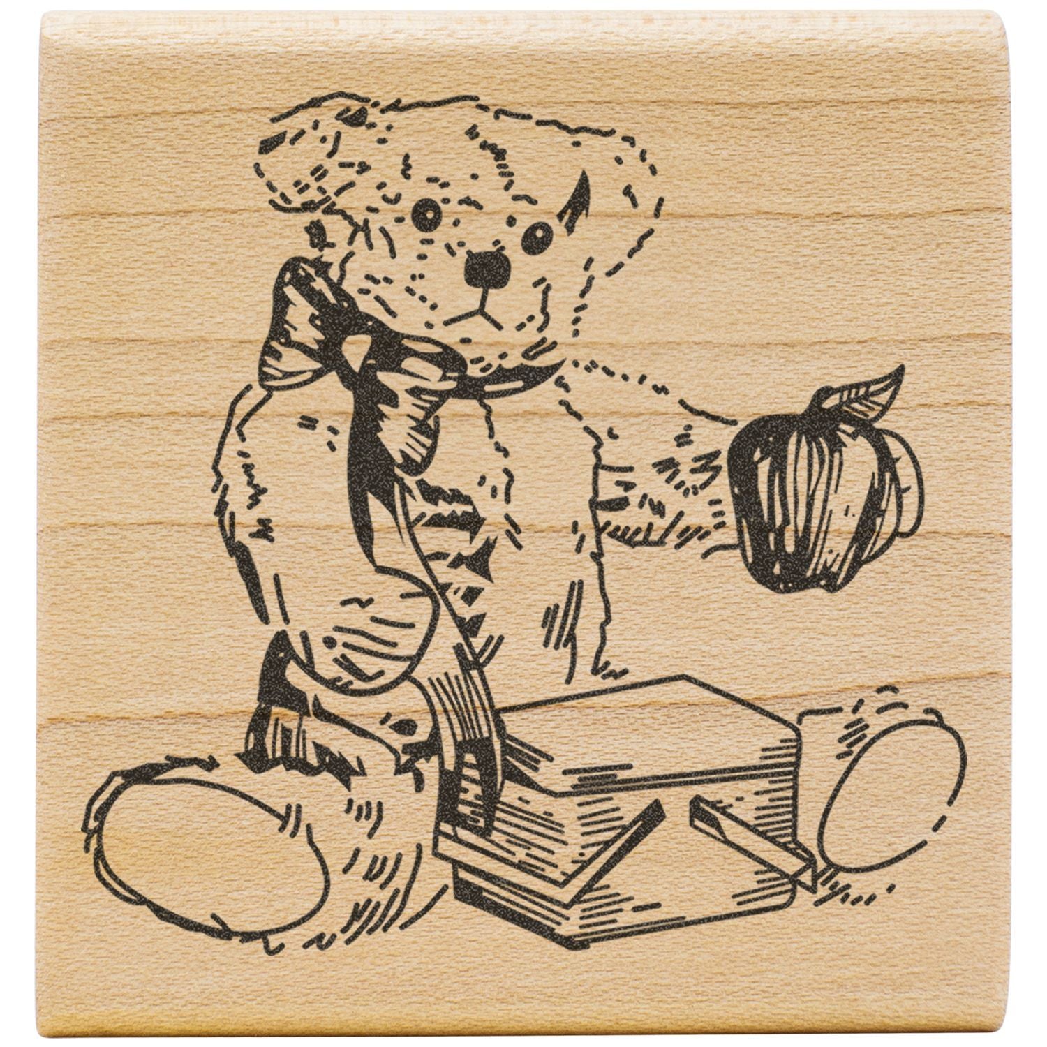 Wood-burned teddy bear illustration on a wooden block with books and an apple, rustic engraved art design.