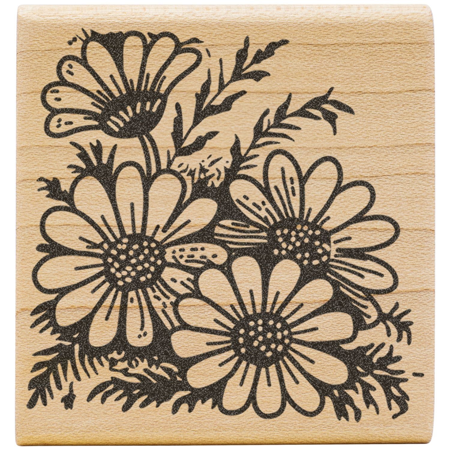 Black floral daisy stamp design on a natural wood block background.