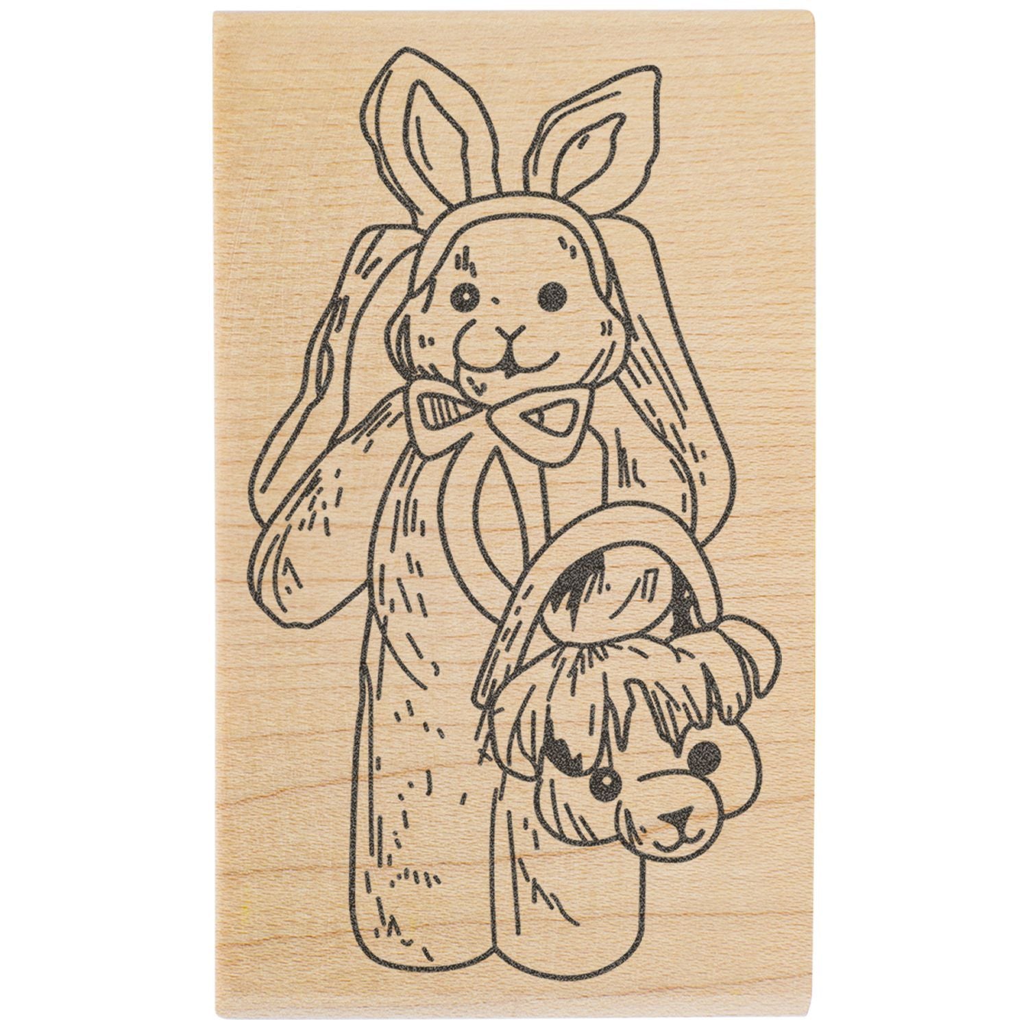 Cute bunny illustration engraved on a wooden stamp block with bow and long ears