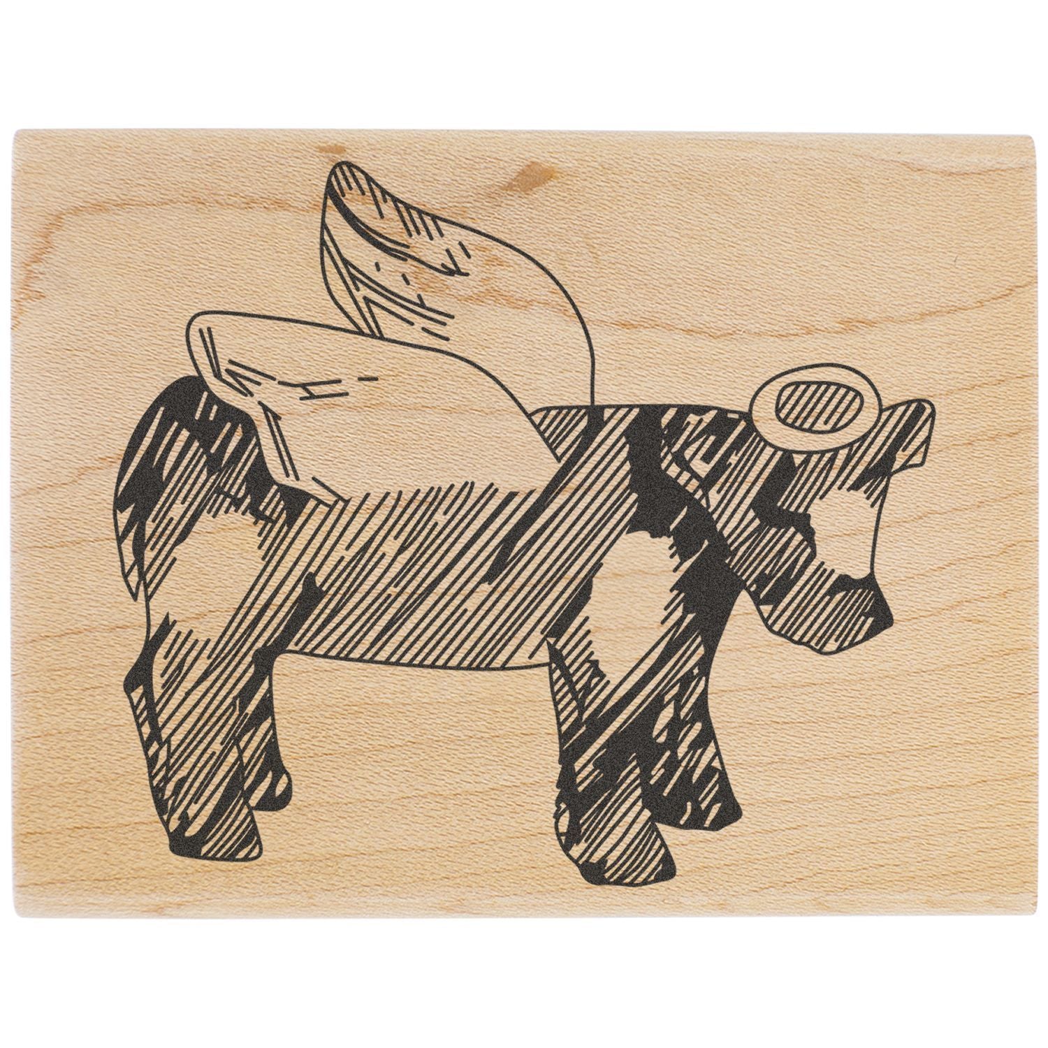Laser-engraved cow illustration on a natural wooden stamp block