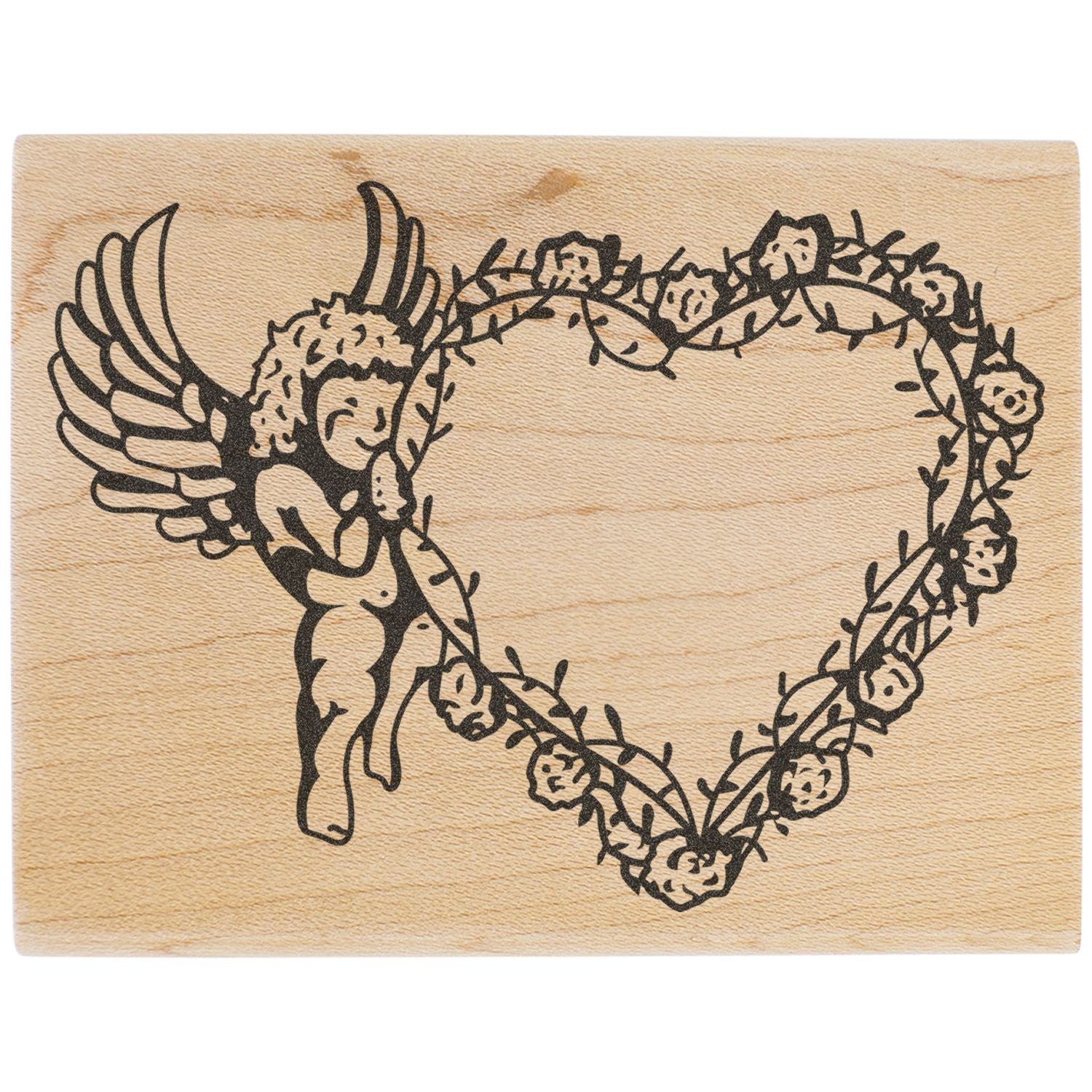 Angel wing heart floral wreath design on natural wood background.