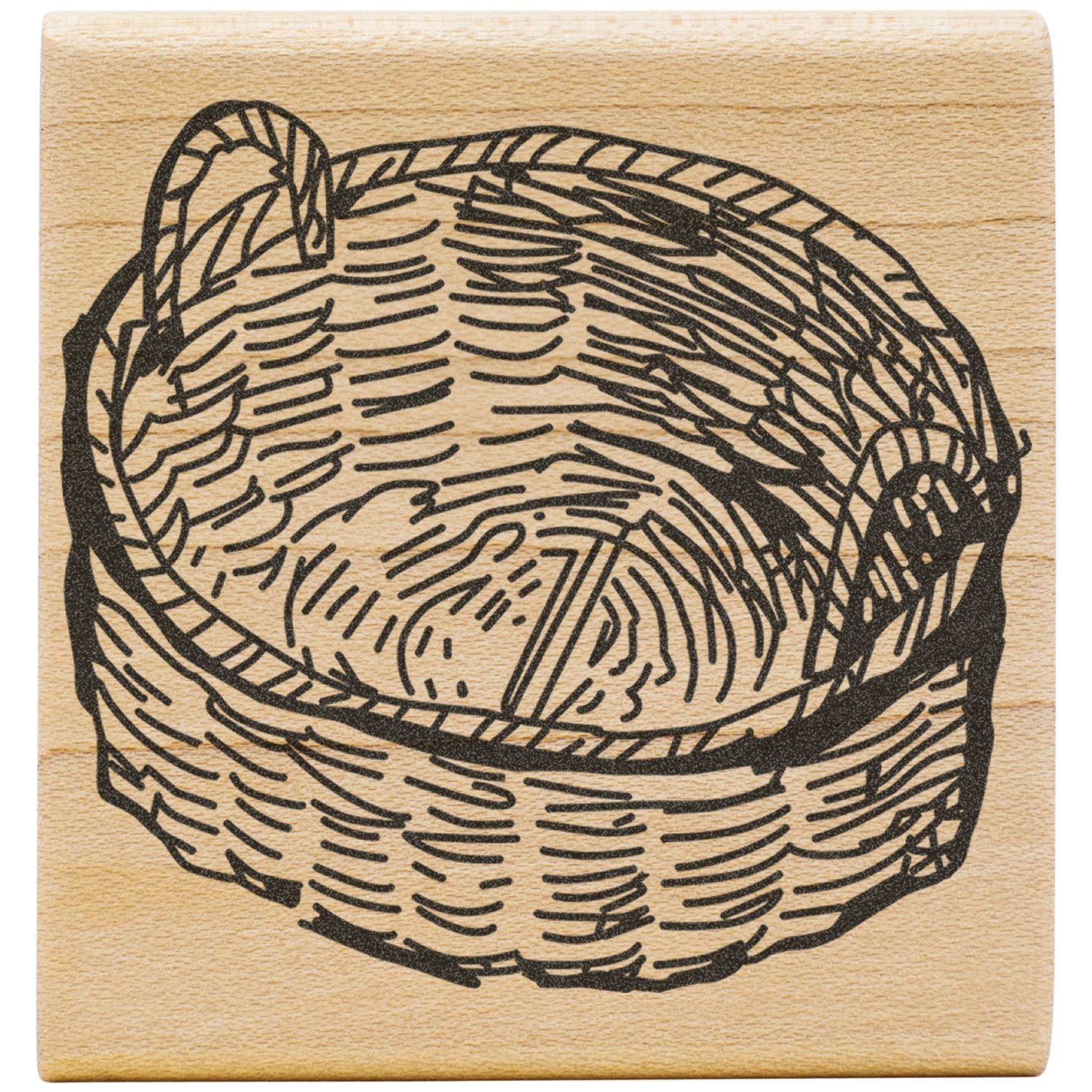Wooden stamp with black woven basket illustration on a light wood background.