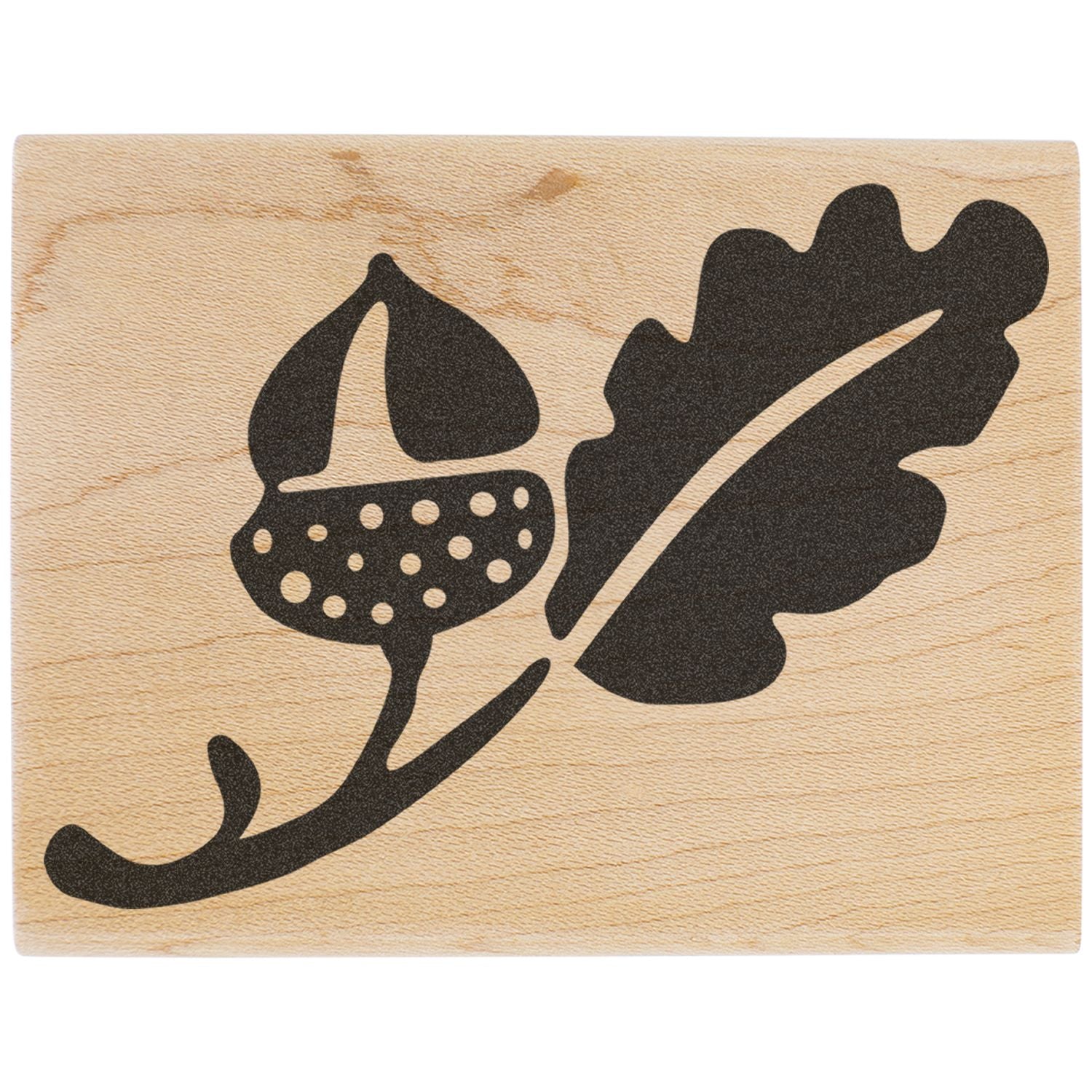 Black floral leaf design on light wood background, decorative botanical engraving on natural wood plaque.