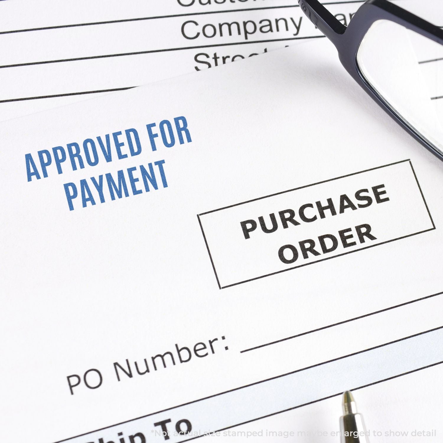 Approved for payment purchase order document with glasses, illustrating accounts payable approval and procurement workflow.