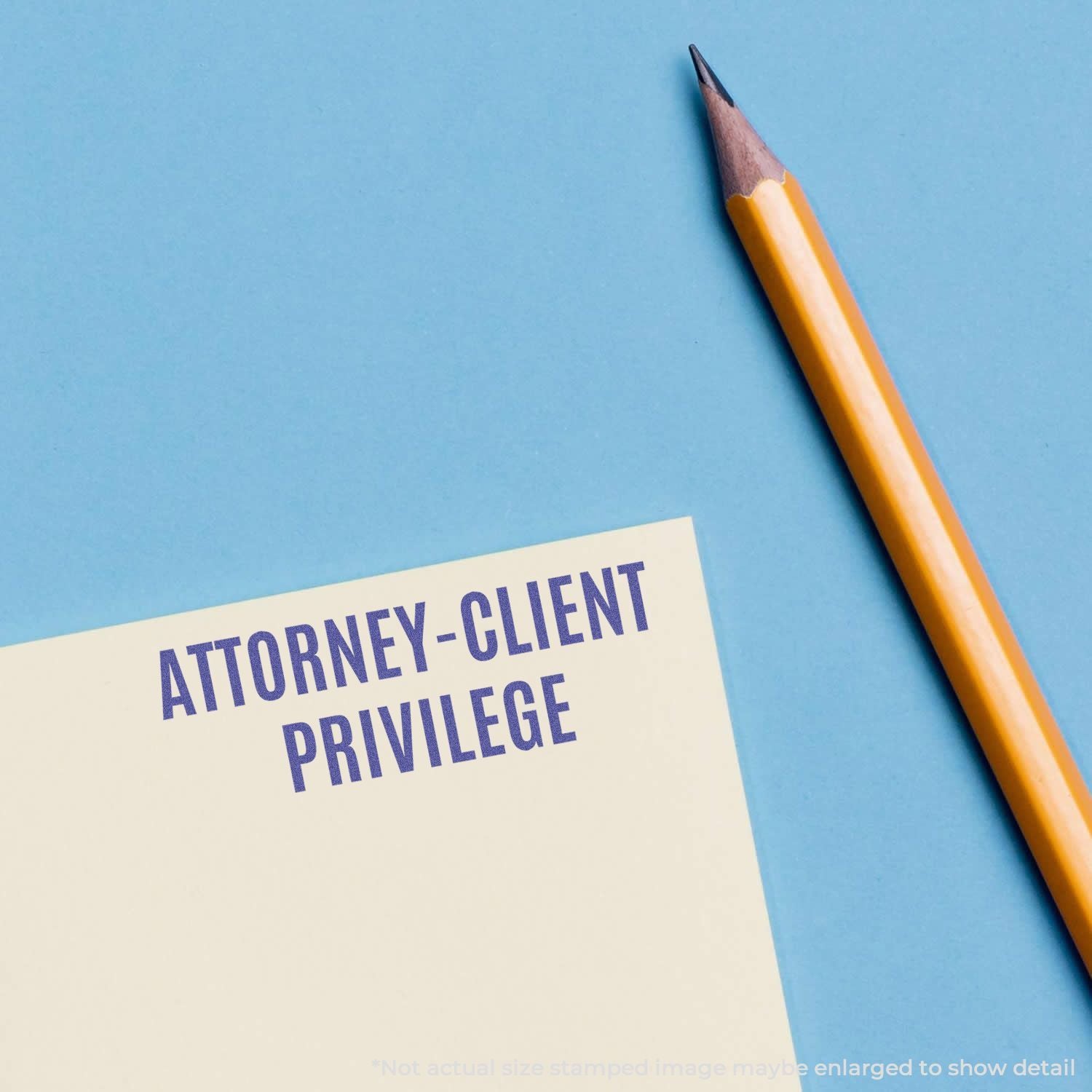 Attorney-client privilege concept: pencil beside note card reading 'Attorney-Client Privilege' for legal confidentiality.
