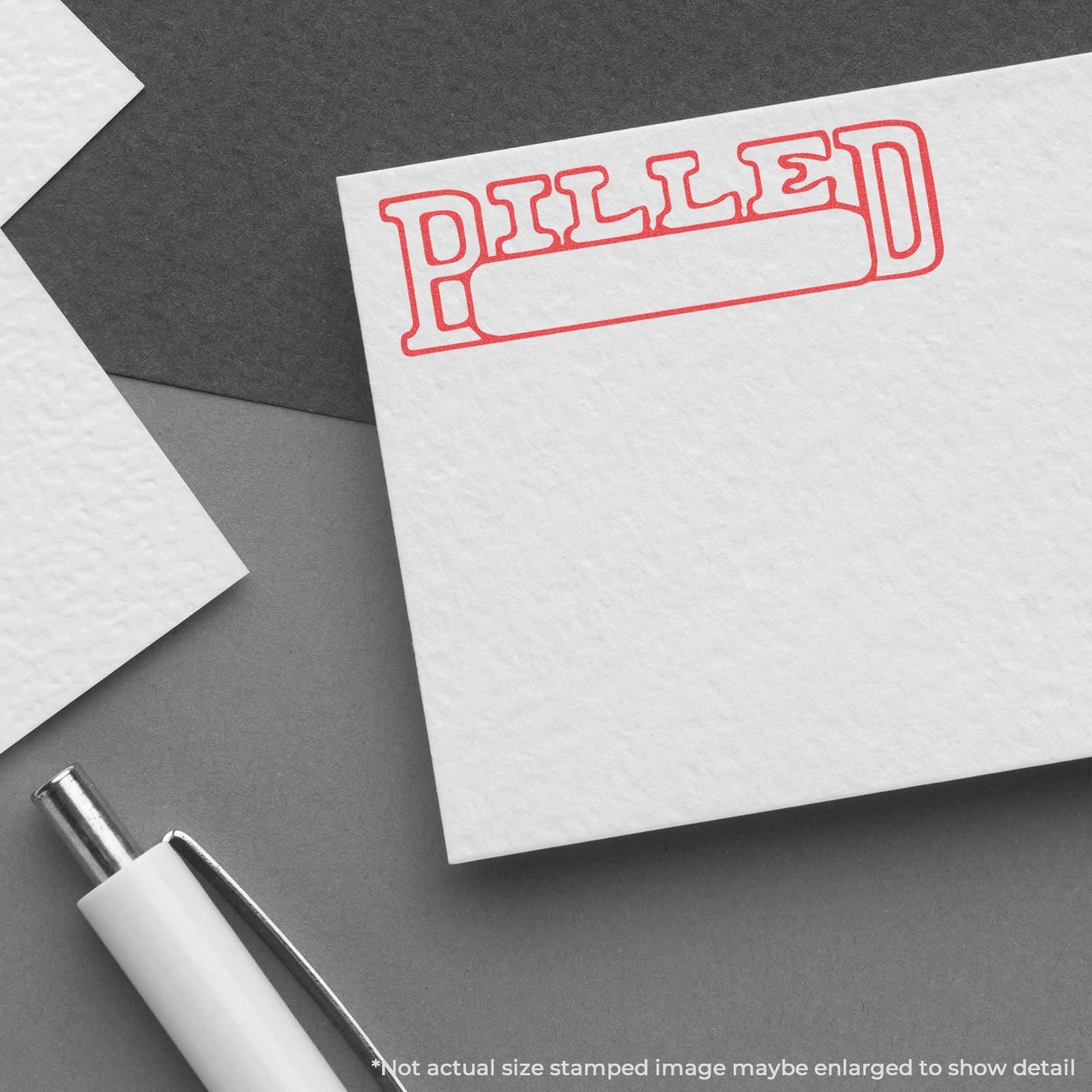 Stamped word DELIVER on stationery card with pen, illustrating a delivery message concept for shipping and logistics branding