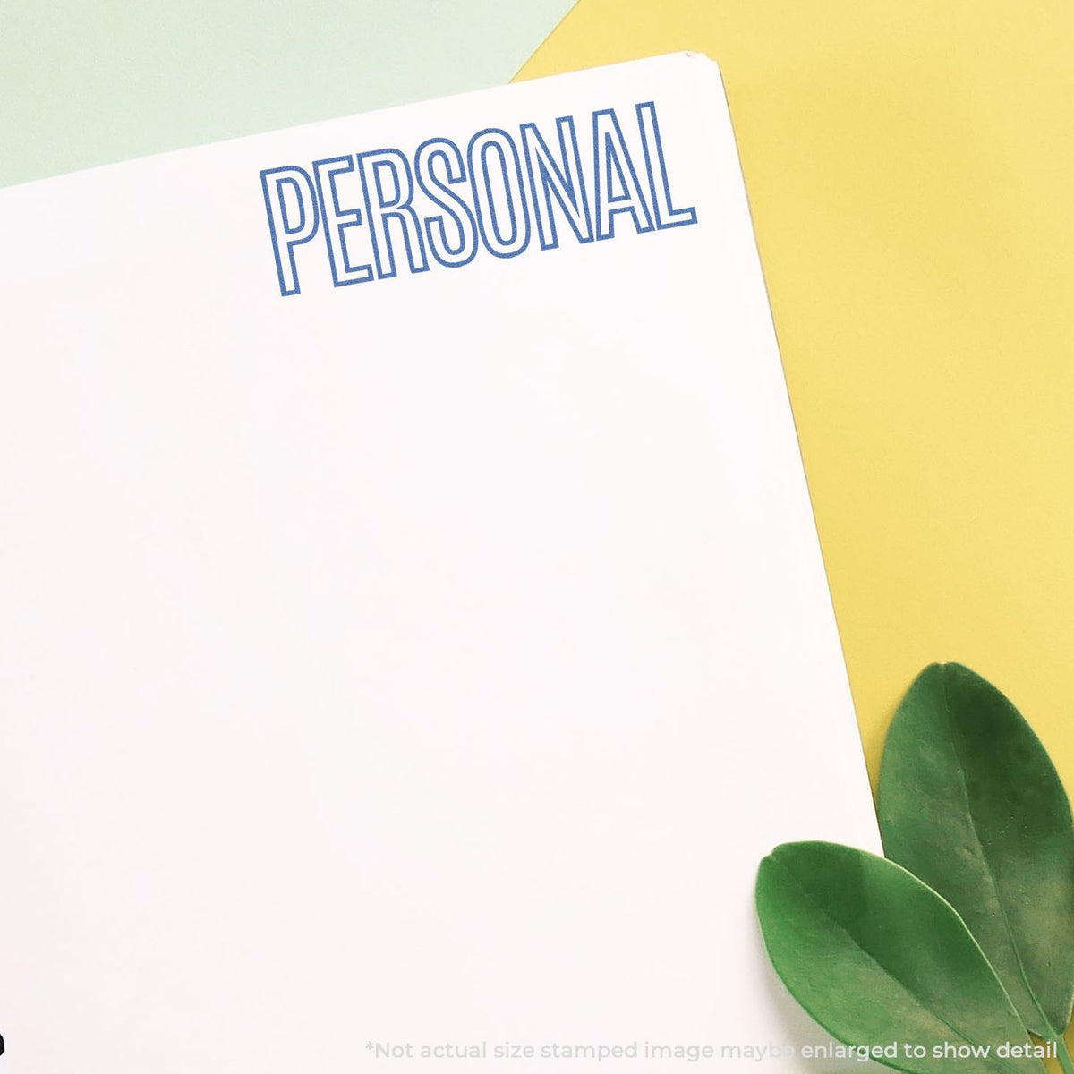 Personal branding card with bold blue PERSONAL text on white paper, pastel background and green leaves for copy space.