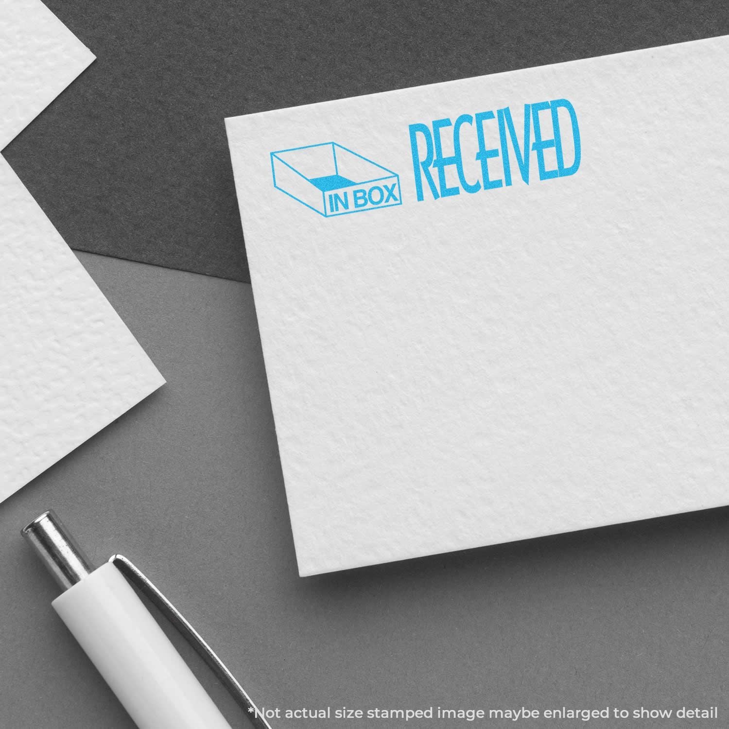 Office stationery showing the Received in Box stamp, symbolizing package delivery notification, mail receipt, and tracking confirmation.