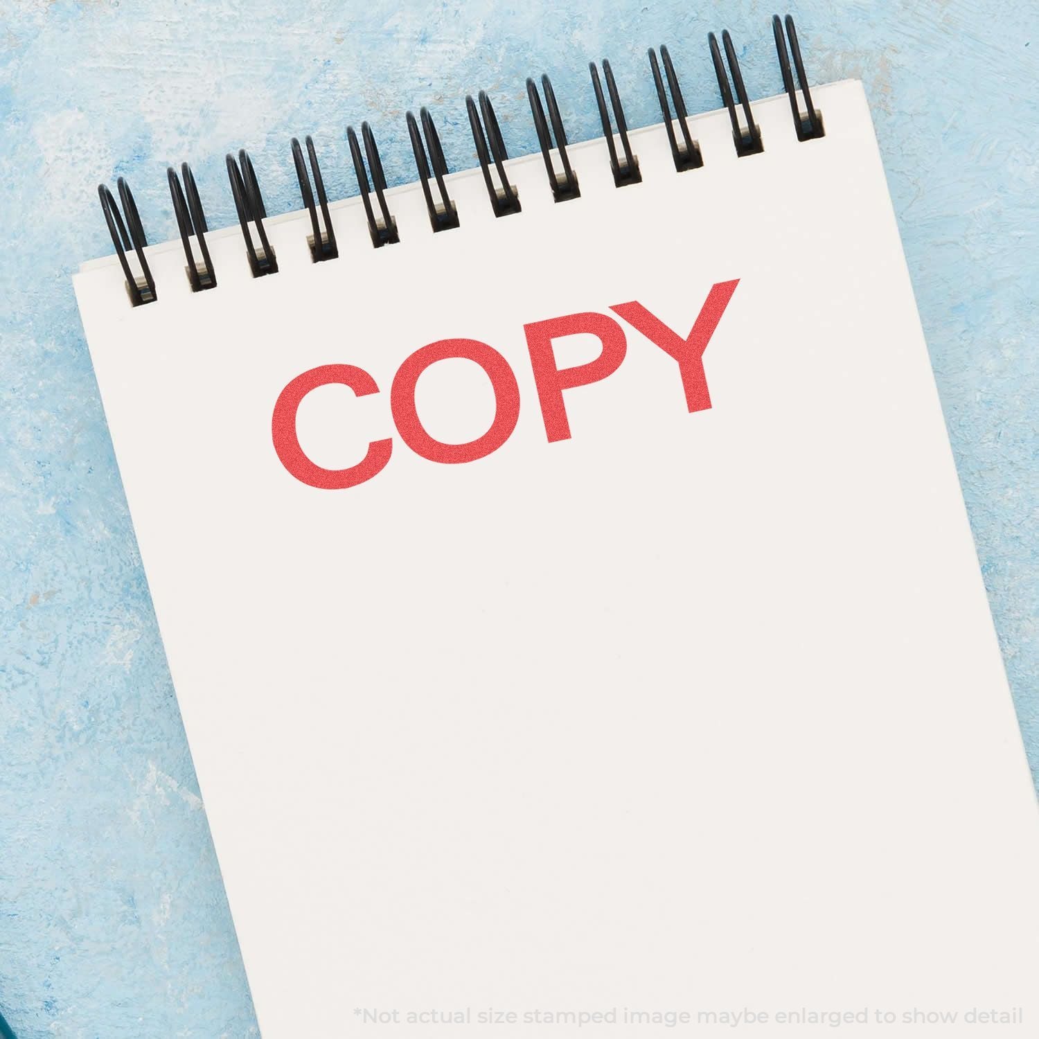 Open notebook with COPY text and binder rings, representing photocopying and printing services.
