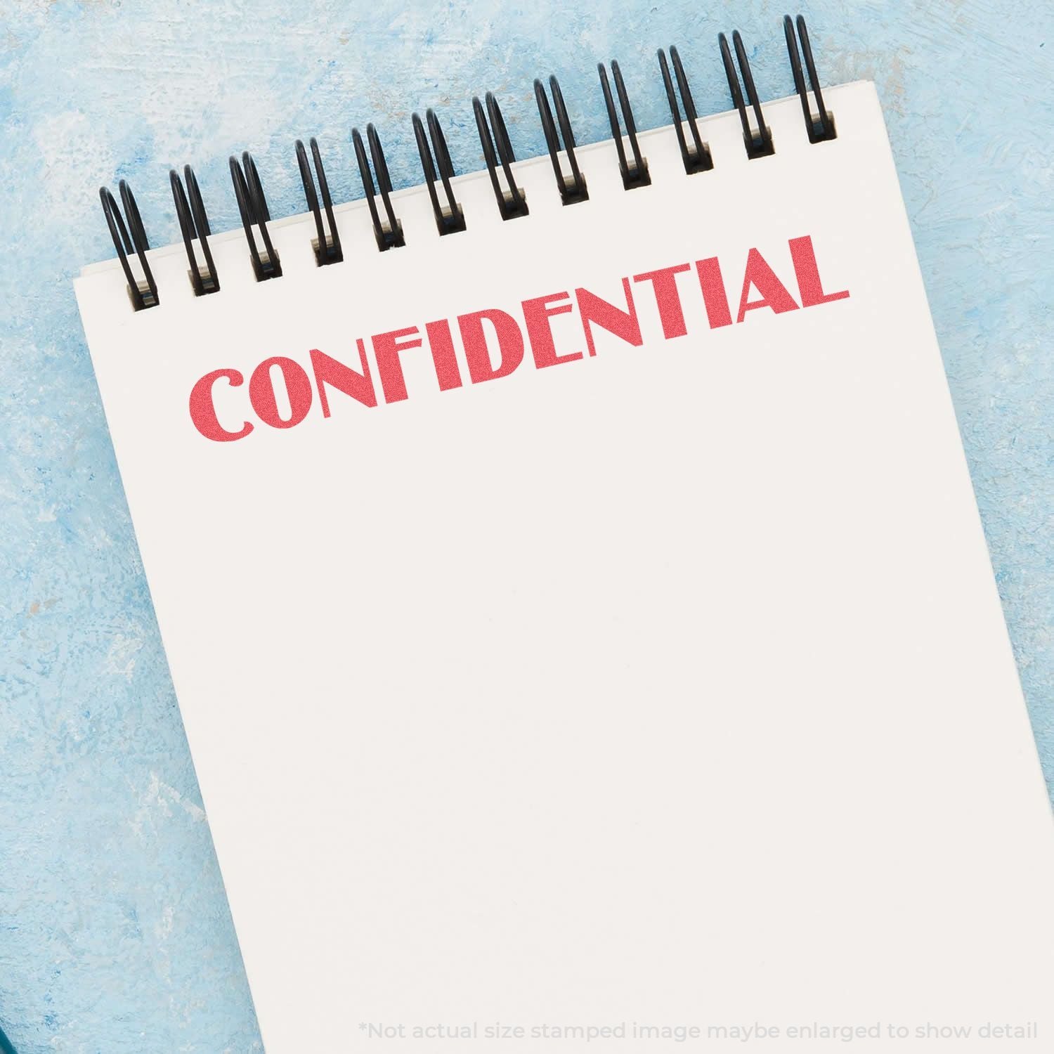 Confidential memo notepad for data privacy messaging, showing the word CONFIDENTIAL on a lined pad with black spiral paper binding.