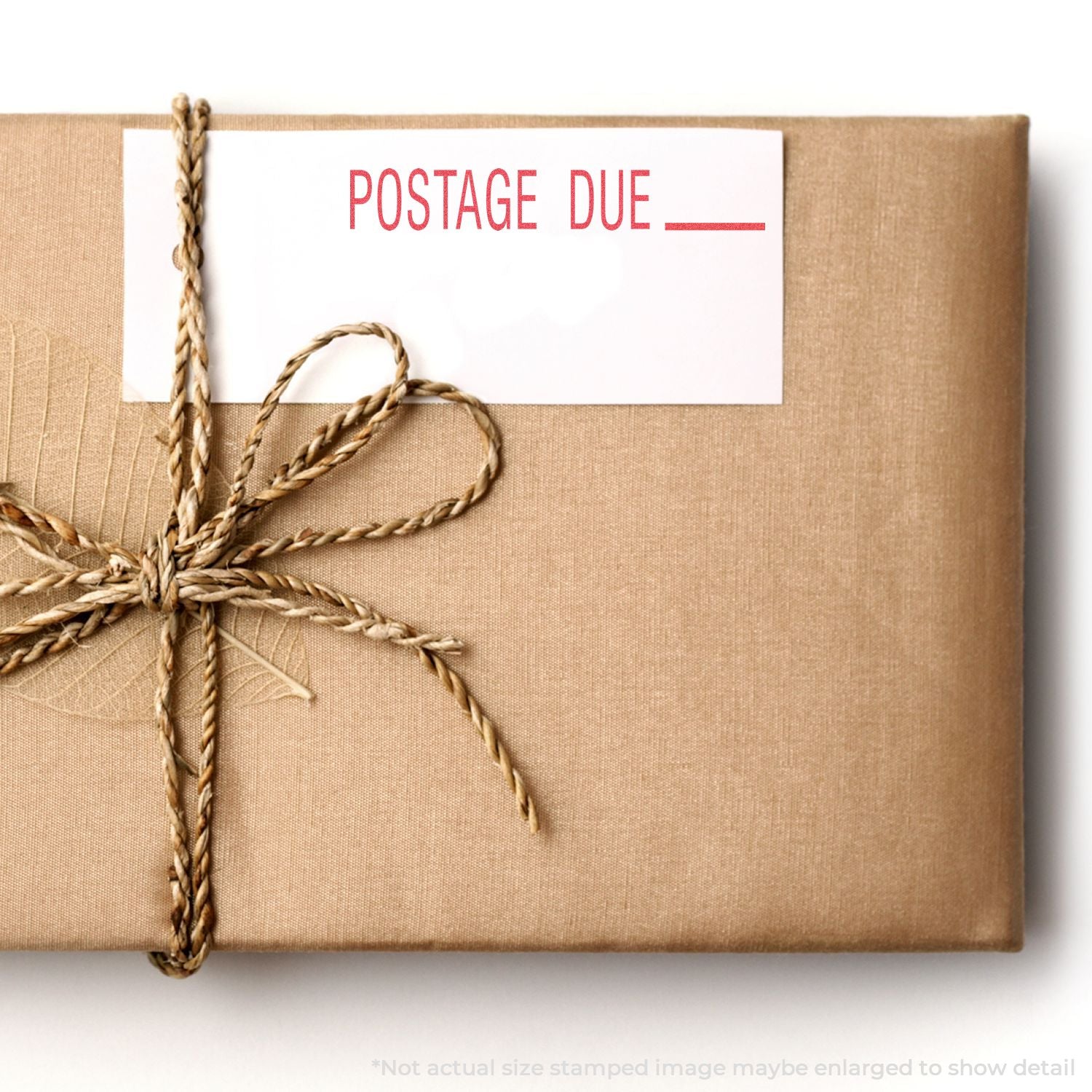 Packaged parcel with twine and a Postage Due label, highlighting late shipping fees and USPS-style postage reminders for delivery.