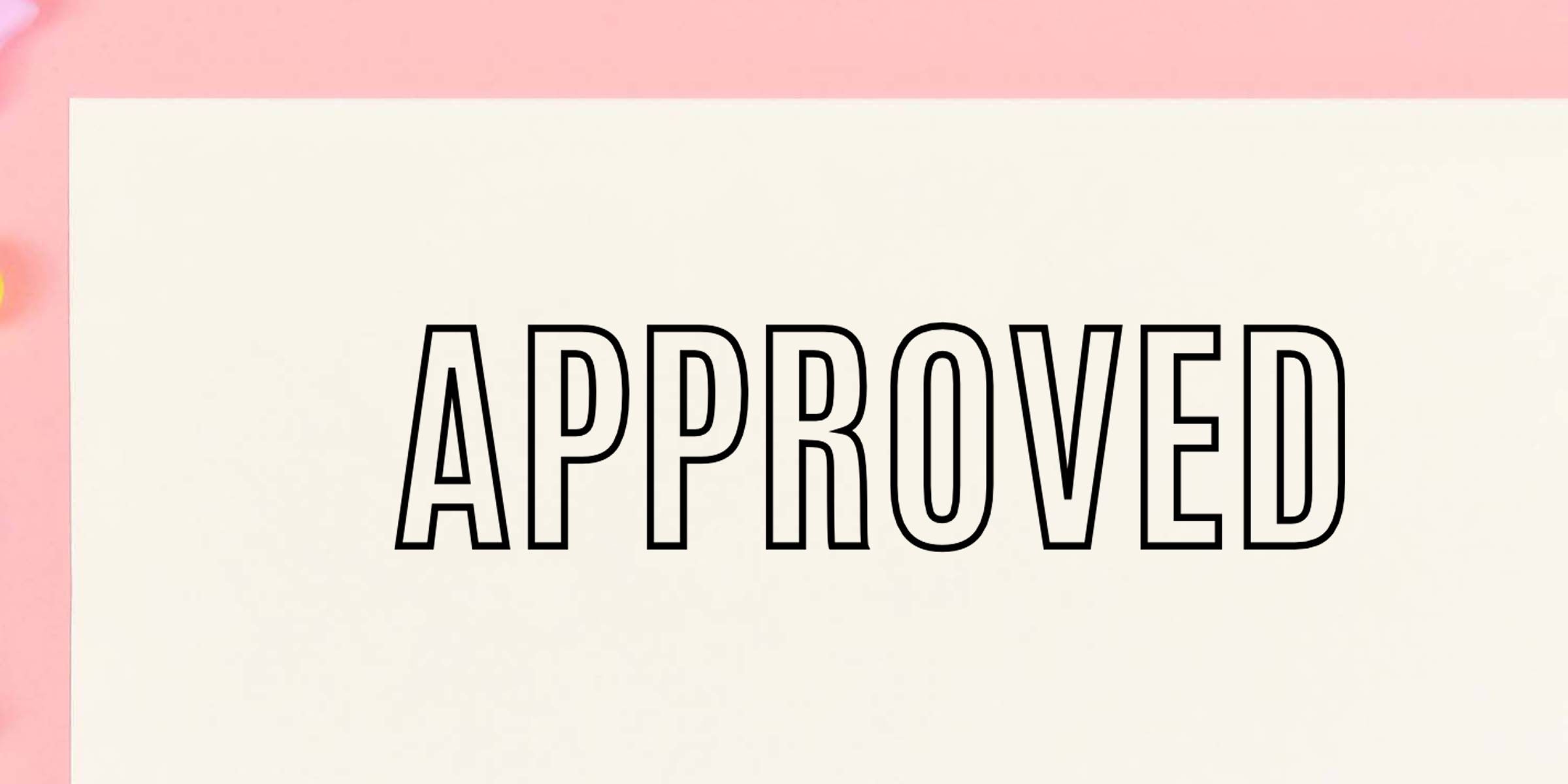 Approved text in bold black outline on a white card with a soft pink background