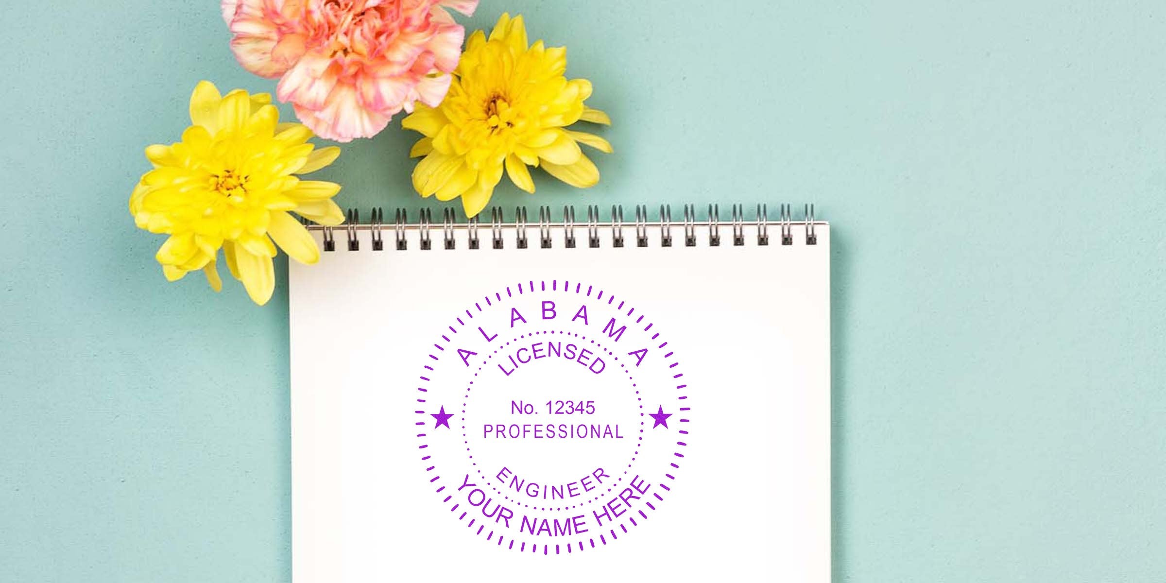Alabama engineer stamp in engineering format on a notebook adorned with yellow and pink flowers.