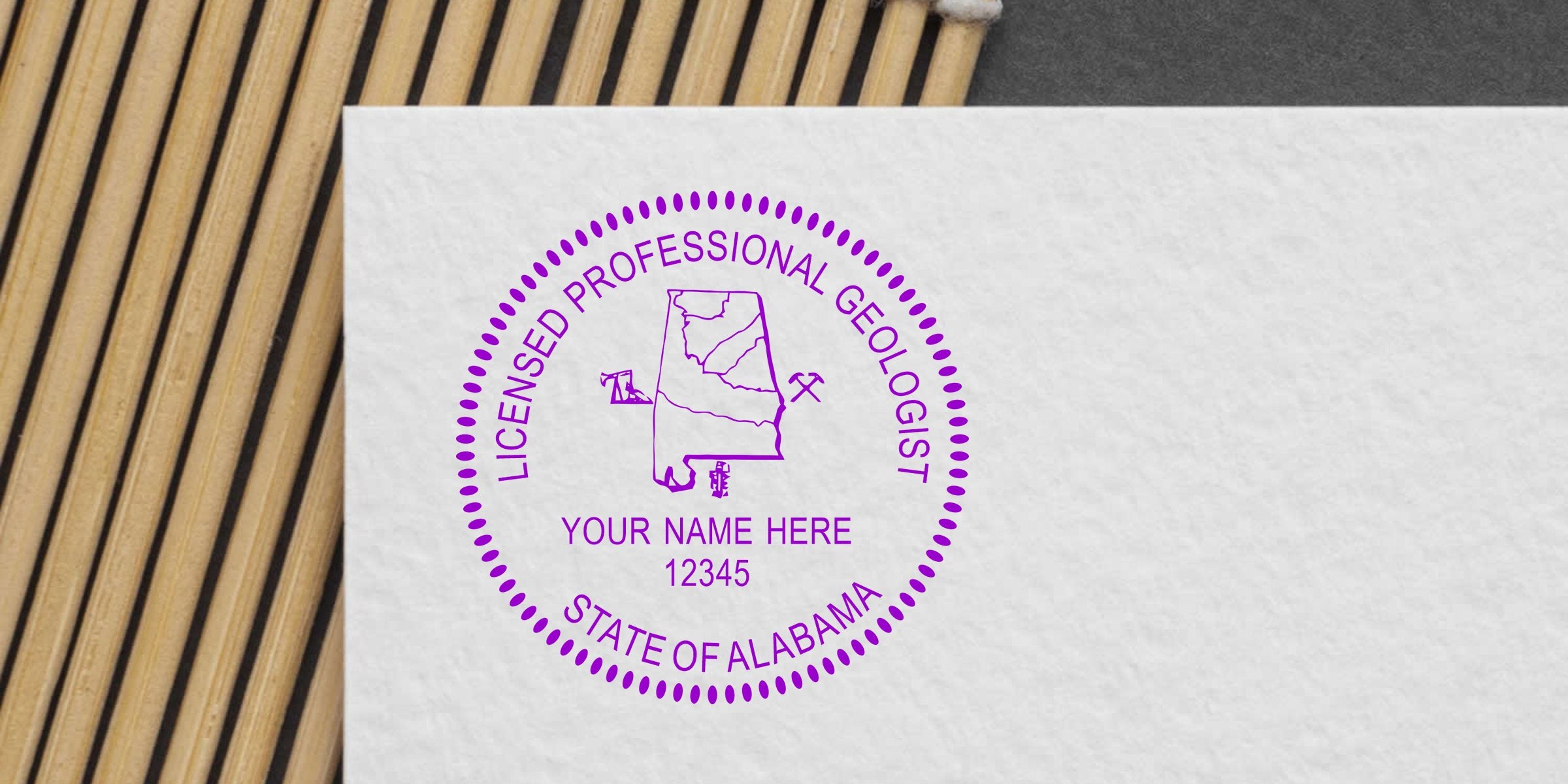 Licensed professional geologist stamp with Alabama state map and mining tools on white paper, showing how to obtain the Geologist Seal Alabama.