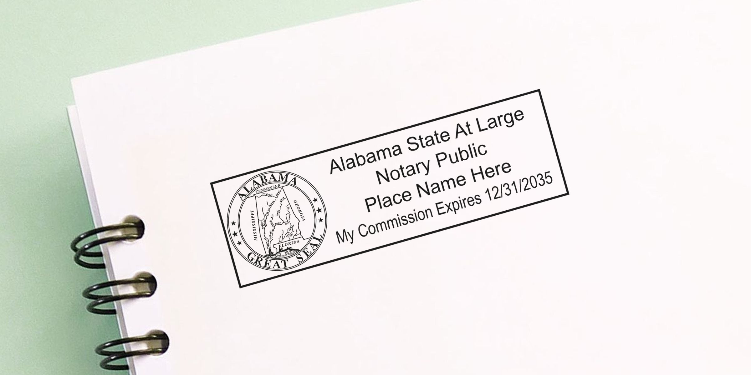 Alabama notary seal featuring state seal and commission expiration date on white paper. Purchase Alabama notary seals here.