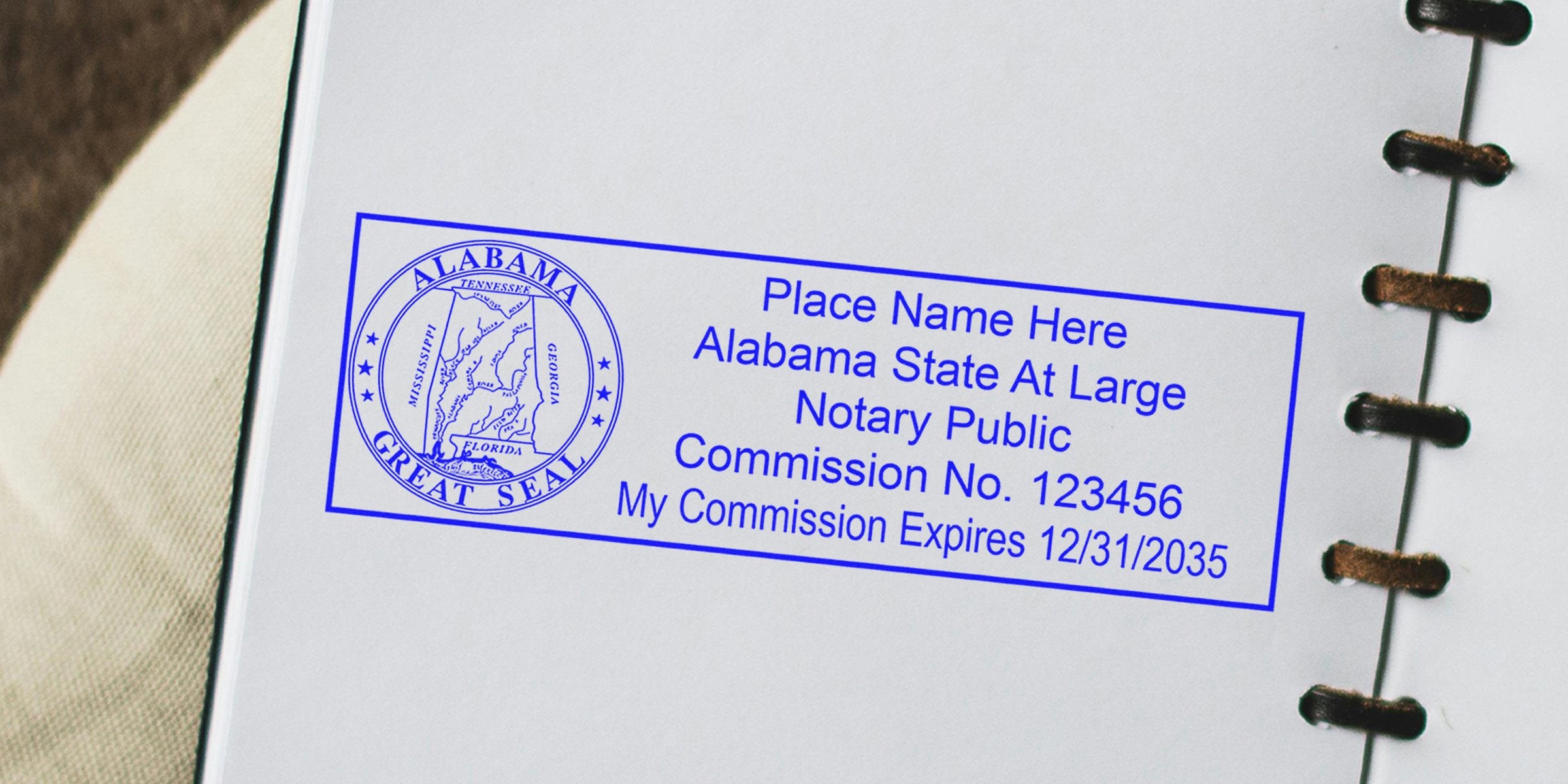 Alabama notary seal stamp with commission number and expiration date on white paper, available for purchase online.