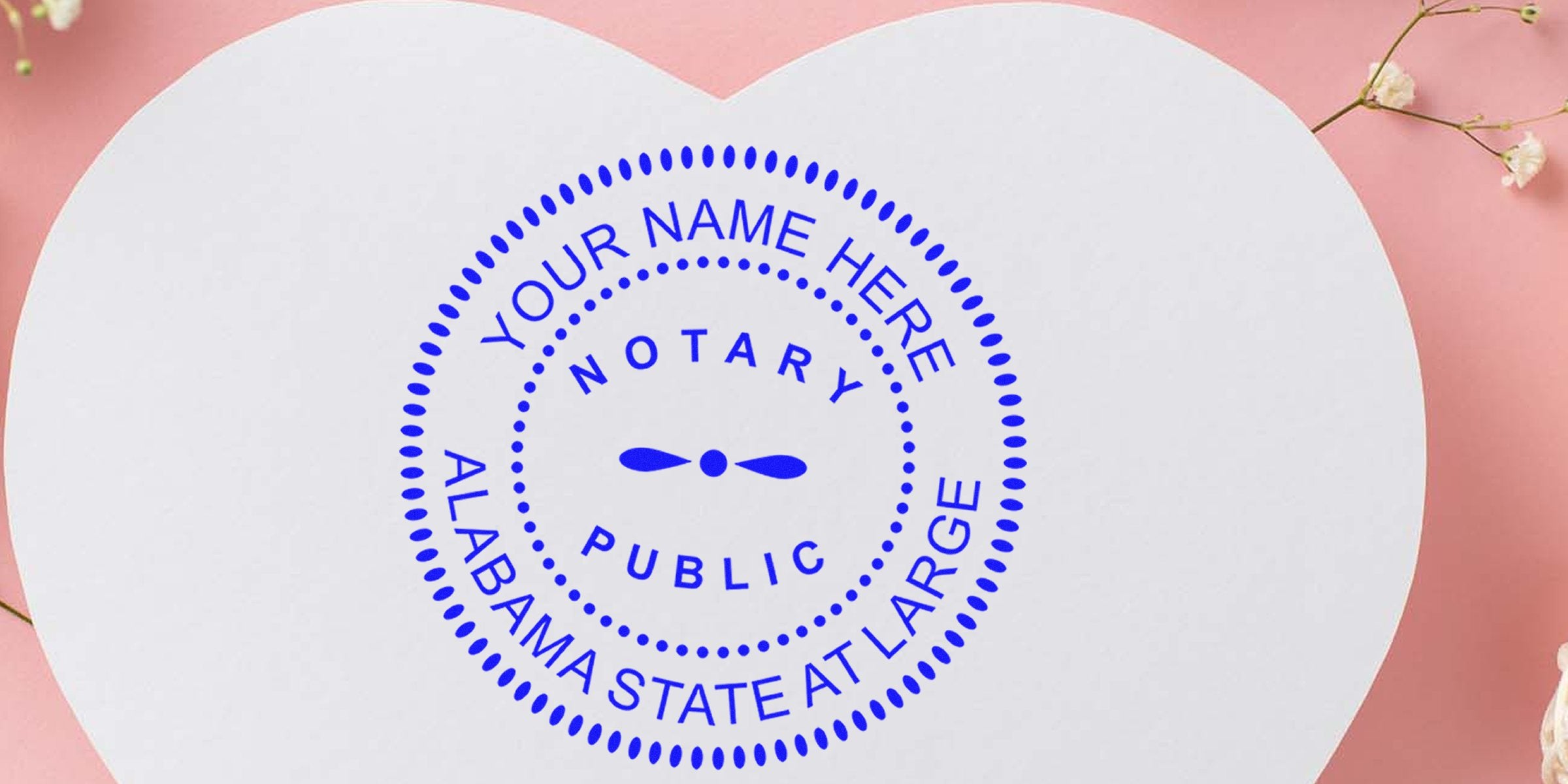 Customizable Alabama notary seal on heart-shaped paper with floral design, fully compliant with Alabama notary seal requirements.
