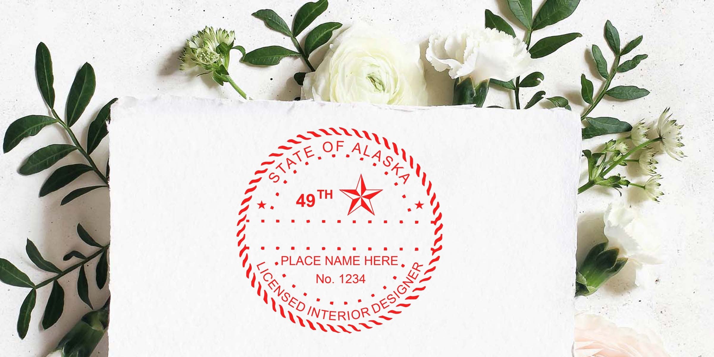 Alaska Interior Designer Stamp on white paper with floral background, showing Interior Designer Stamp Alaska and referencing Alaska Interior Design Regulations.