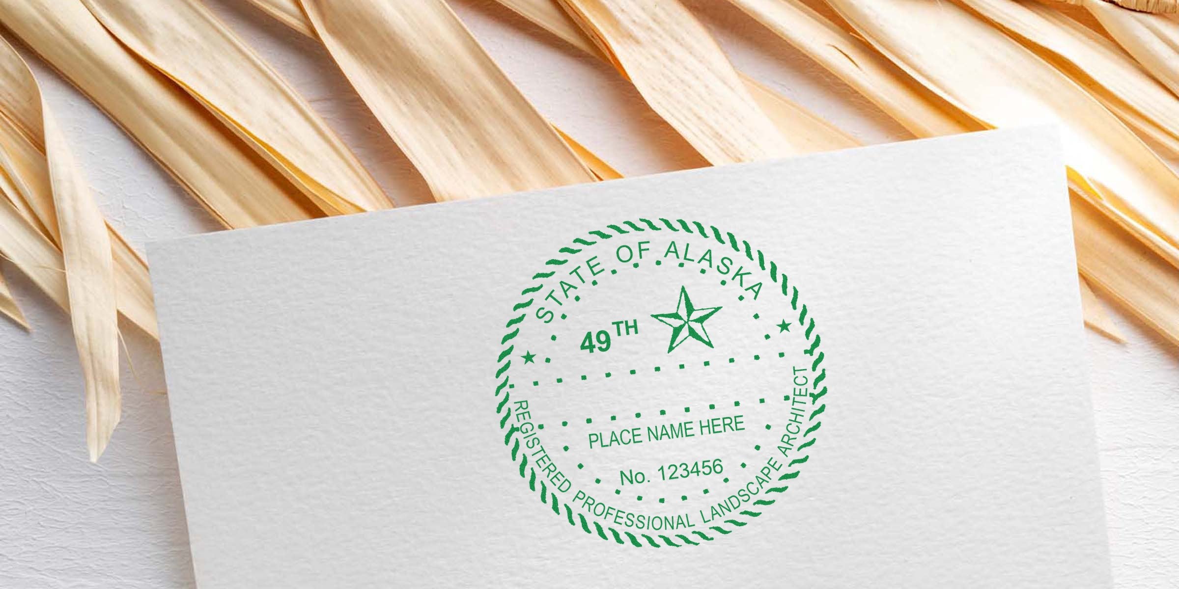 Alaska landscape architect stamp on white paper with registered professional seal, natural wood background, meeting Alaska landscape architect stamp requirements.