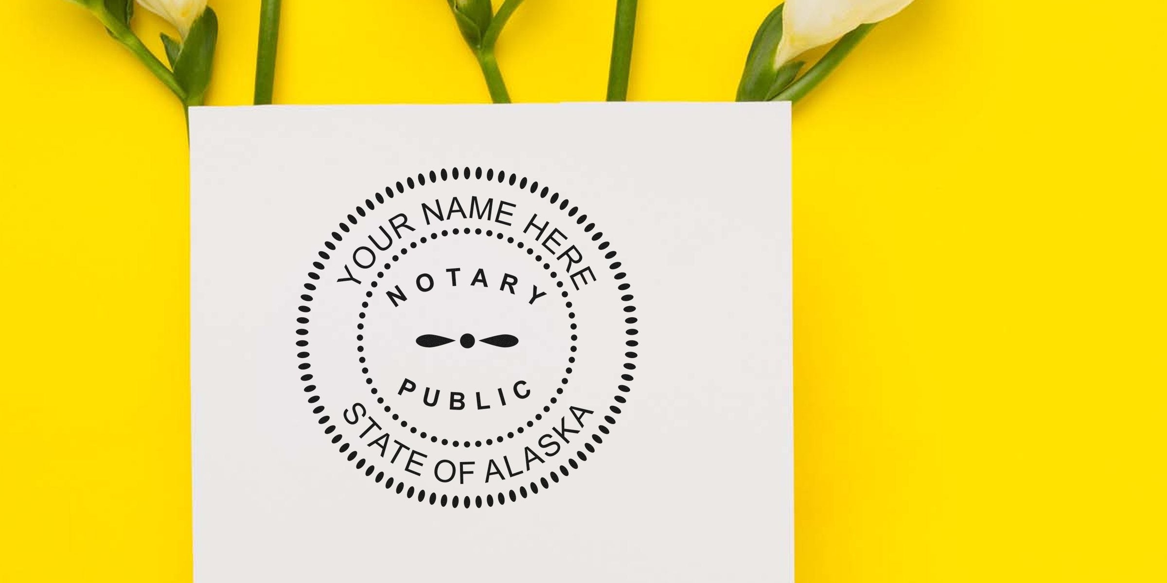 Alaska notary public seal on white paper, surrounded by notary supplies, set against a yellow background with white flowers.