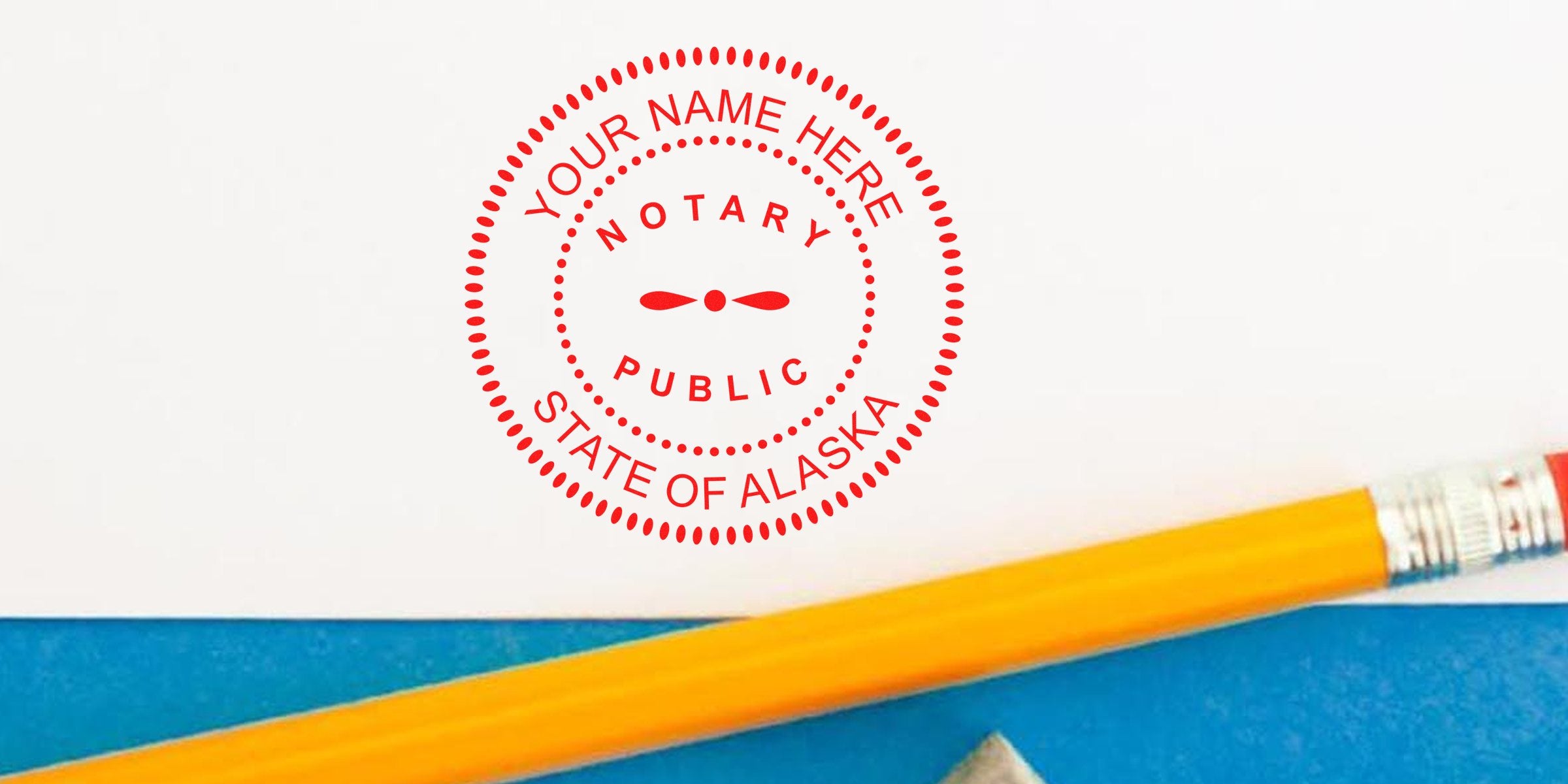 Alaska notary stamp on document with pencil and blue folder, showing official Alaska notary seal for certified services.