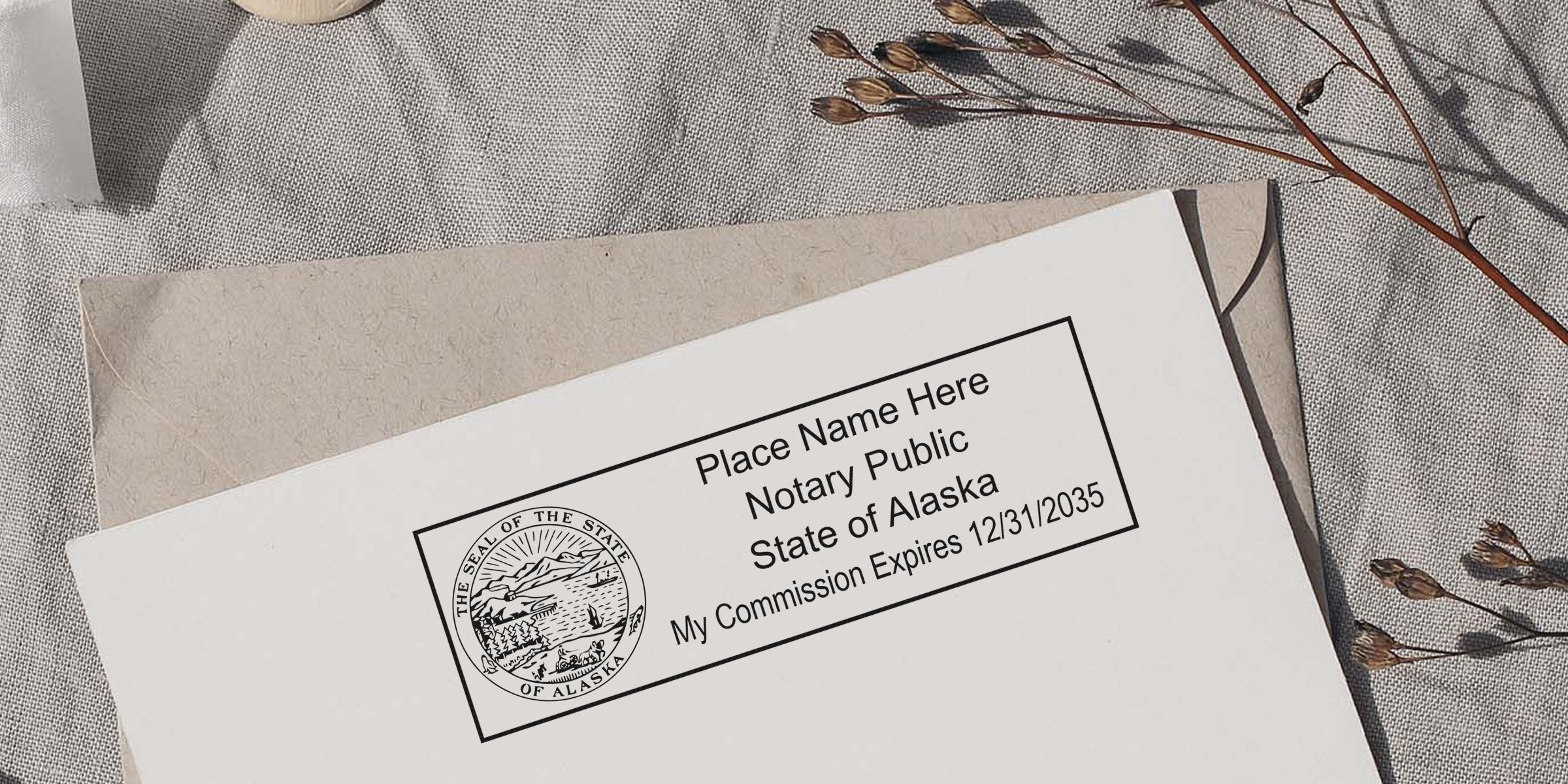 Alaska notary stamp on envelope shows commission expiration date and state seal, part of top-quality notary supplies in Alaska.