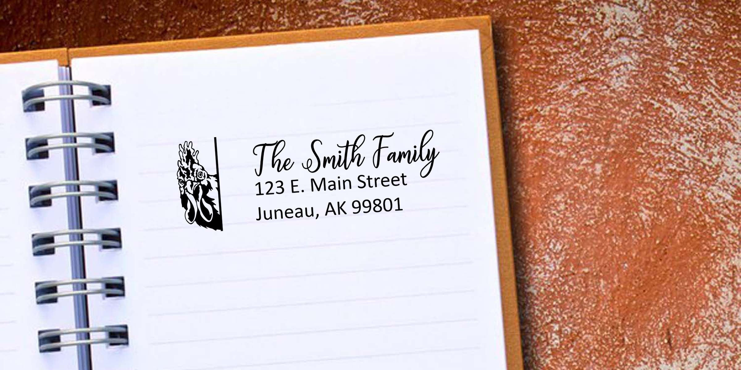 Personalized spiral notebook with custom chicken logo and family name, The Smith Family, 123 E. Main Street, Juneau, Alaska 99801