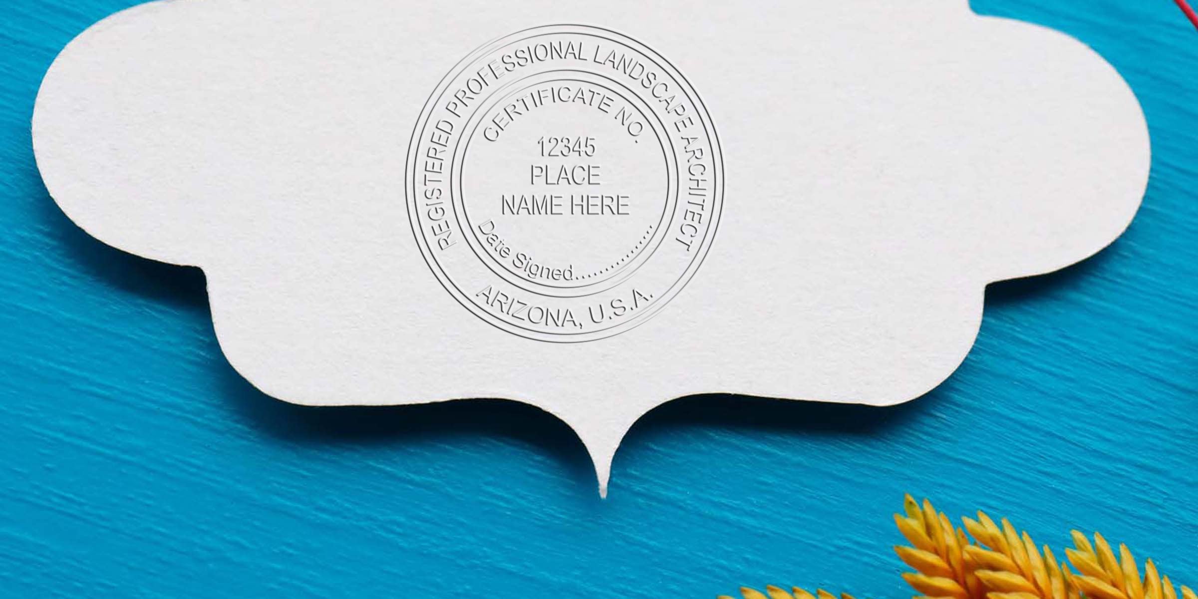 Registered professional landscape architect certificate embossed on white paper with yellow flowers on blue wood background, featuring an Arizona landscape architect stamp of ideal size.