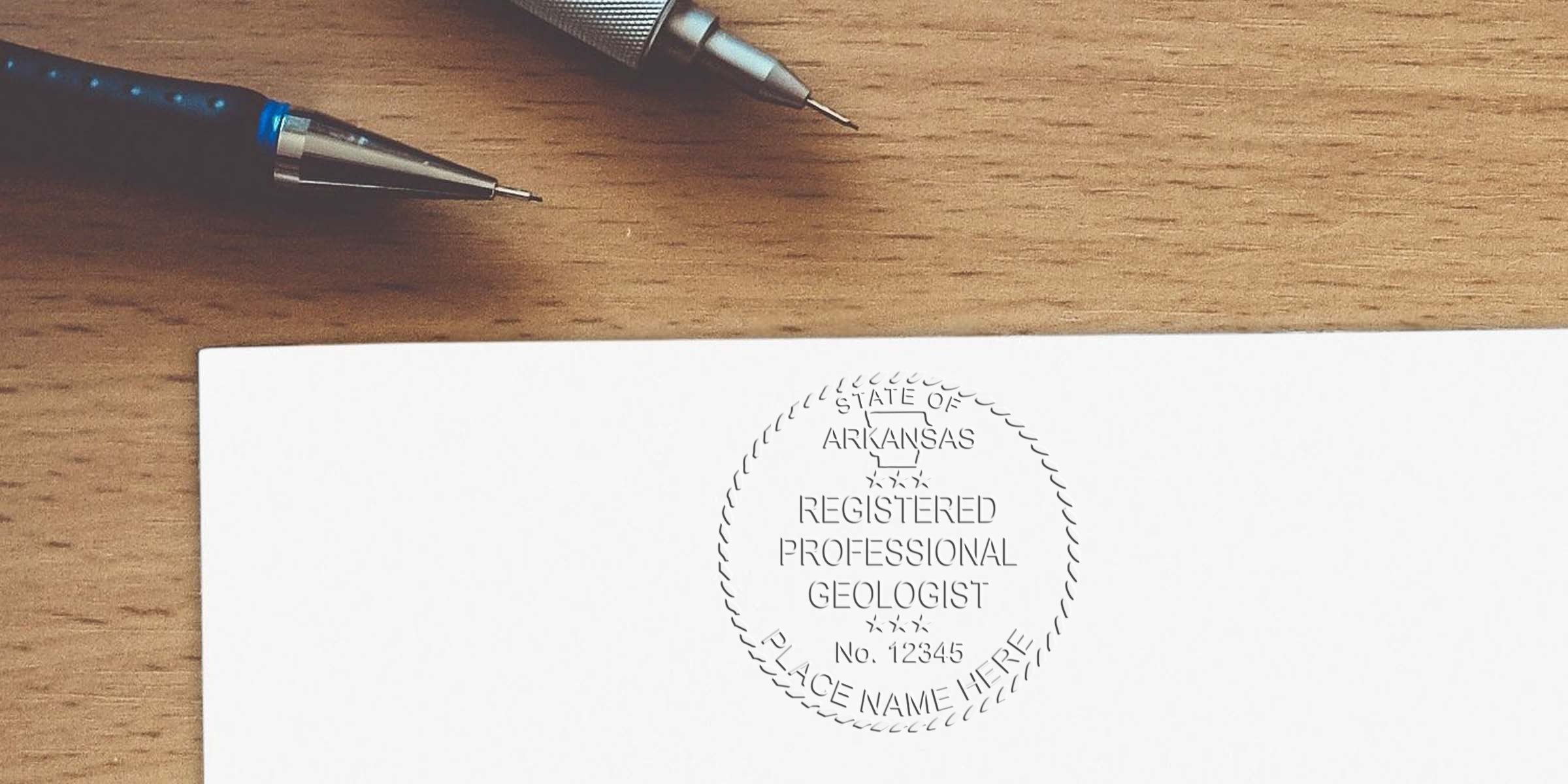 Arkansas Geologist Seal stamped on white paper with pens on a wooden desk for professional certification.
