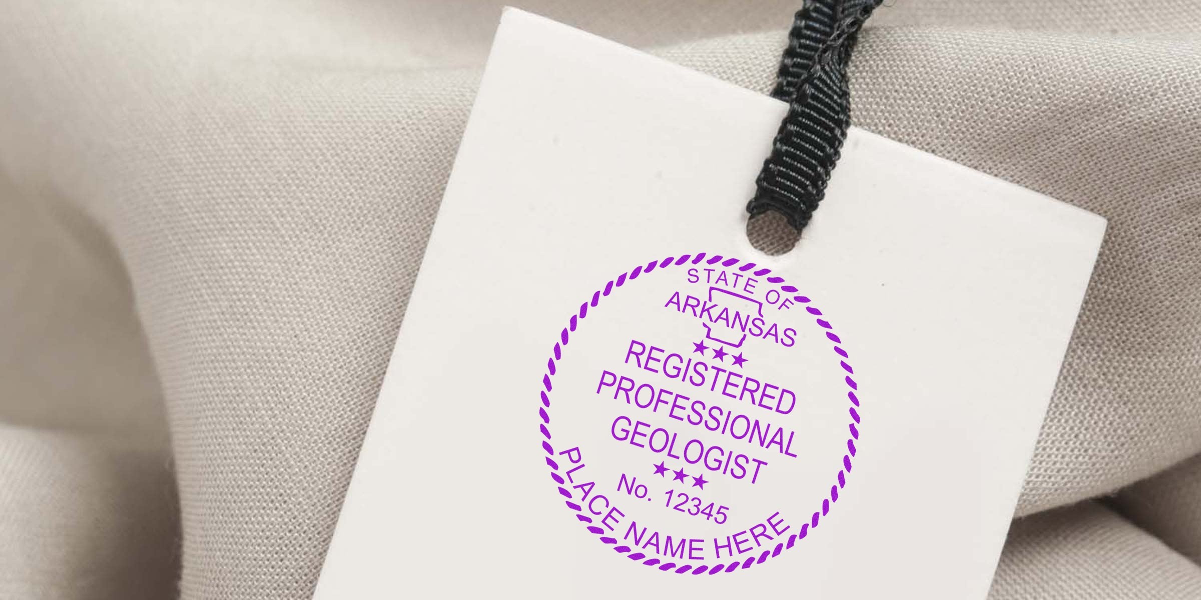 Arkansas geologist stamp on white tag with black string, Arkansas registered professional geologist stamp, purchase geologist stamp online.