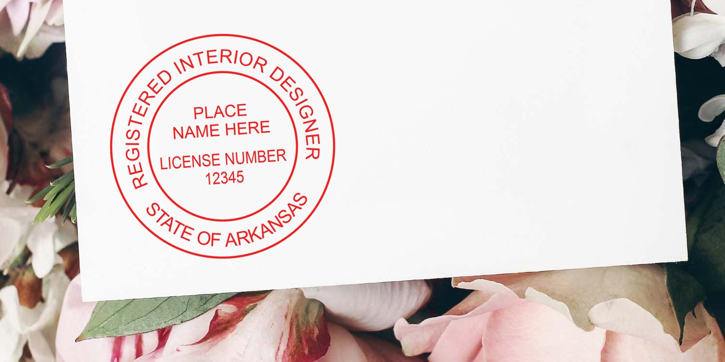 Interior Designer Stamp Arkansas with registered seal and license number 12345 on white card with floral background.