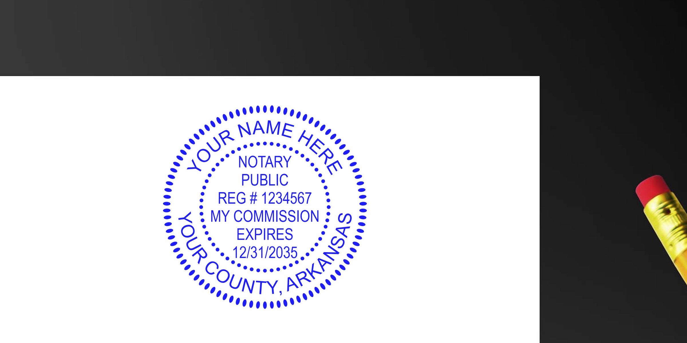 Custom Arkansas notary stamp with commission expiration on white paper, yellow pencil with red eraser—part of the Arkansas notary starter kit.