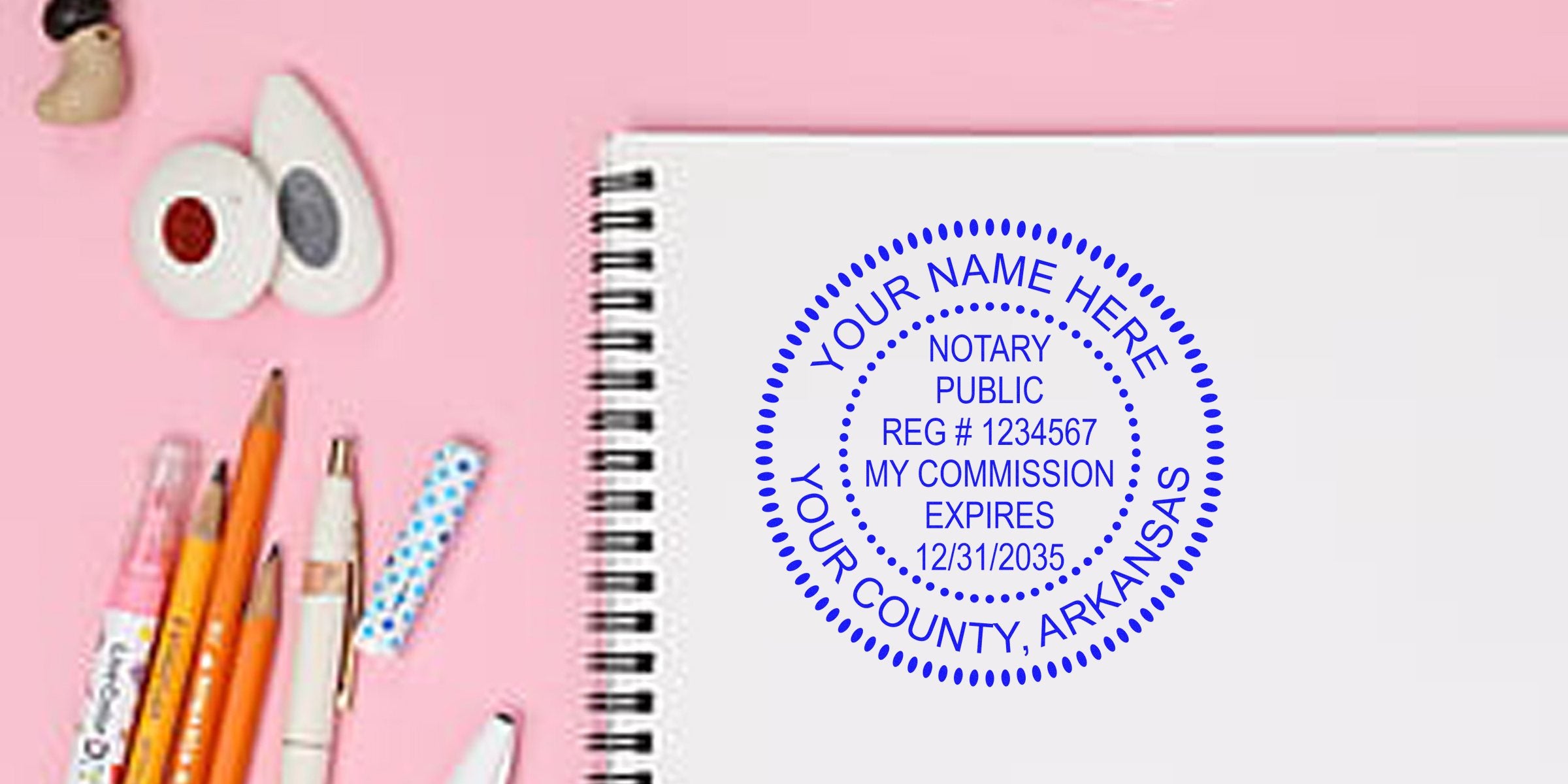 Arkansas notary stamp on notebook with office supplies, displaying Arkansas notary seal, commission expiration, registration number, and meeting Arkansas notary stamp requirements.