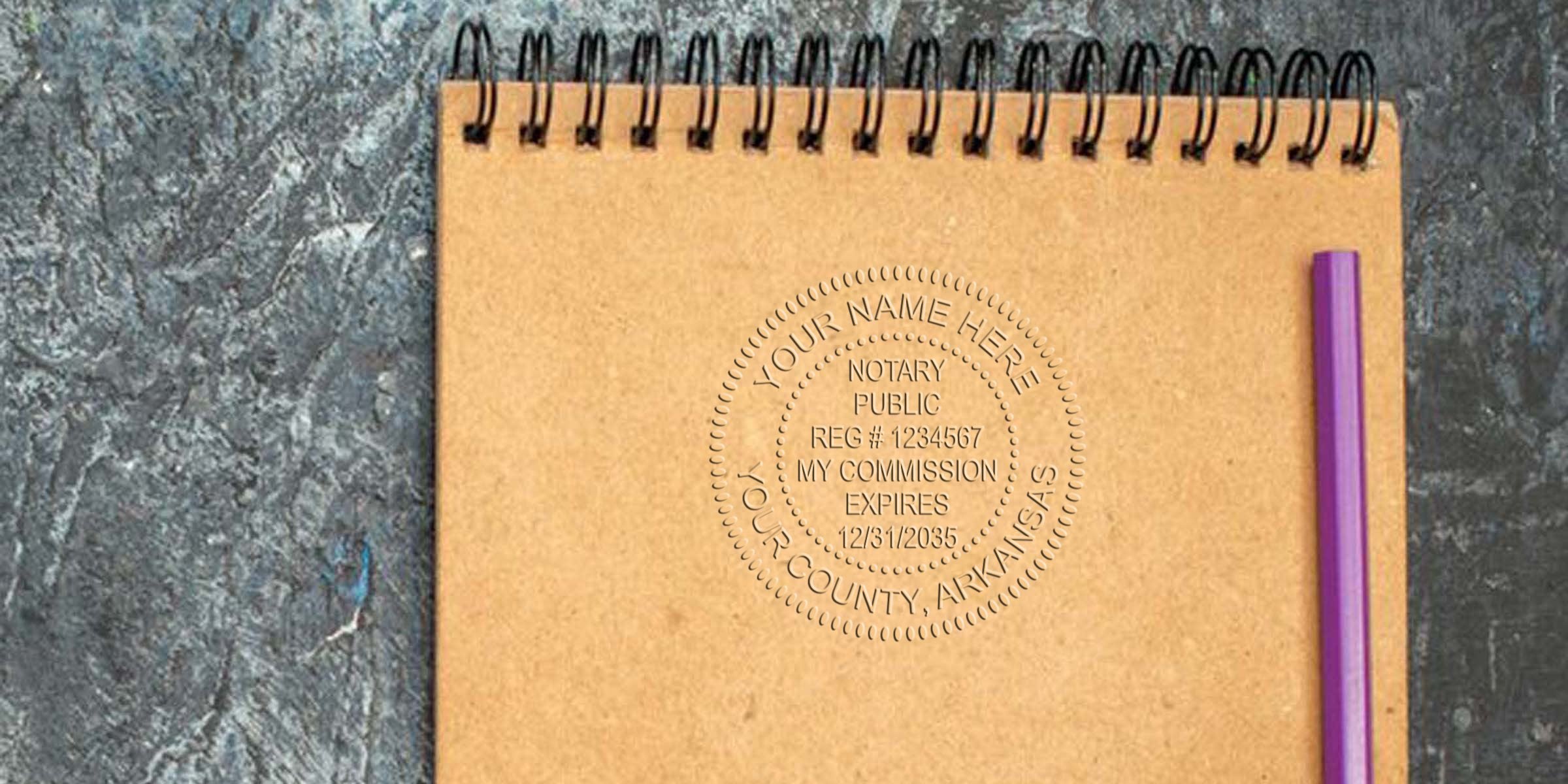 Arkansas notary stamp embossed on brown spiral notebook with purple pen, highlighting online notary services on a textured surface.