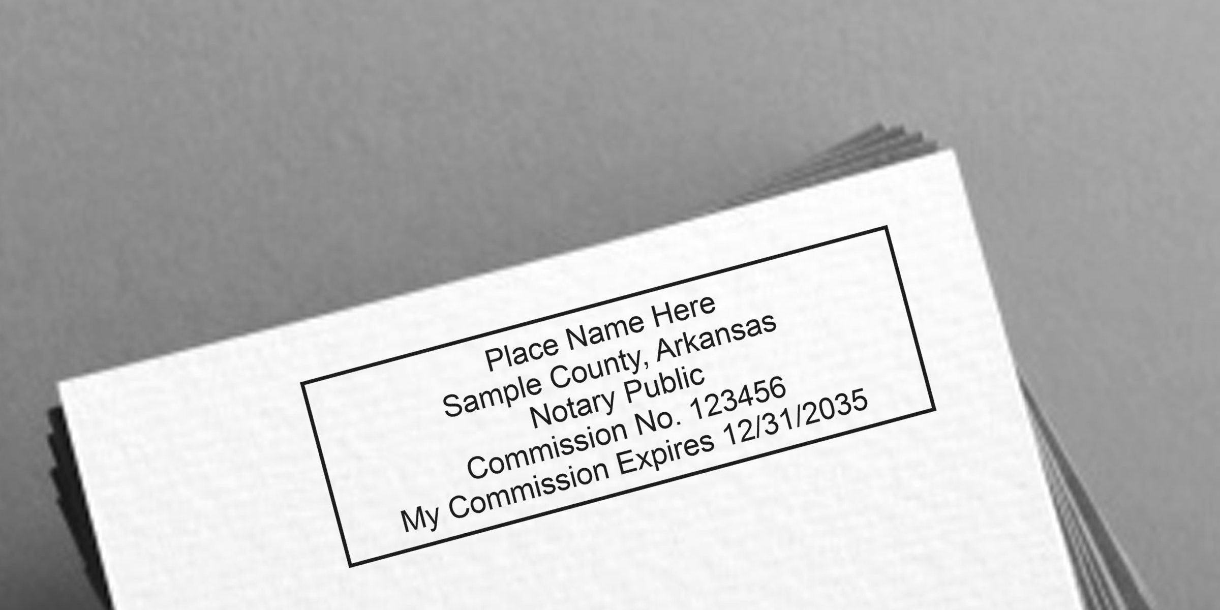 Arkansas notary seal stamp with expiration date on white paper, symbolizing trustworthy notary services.