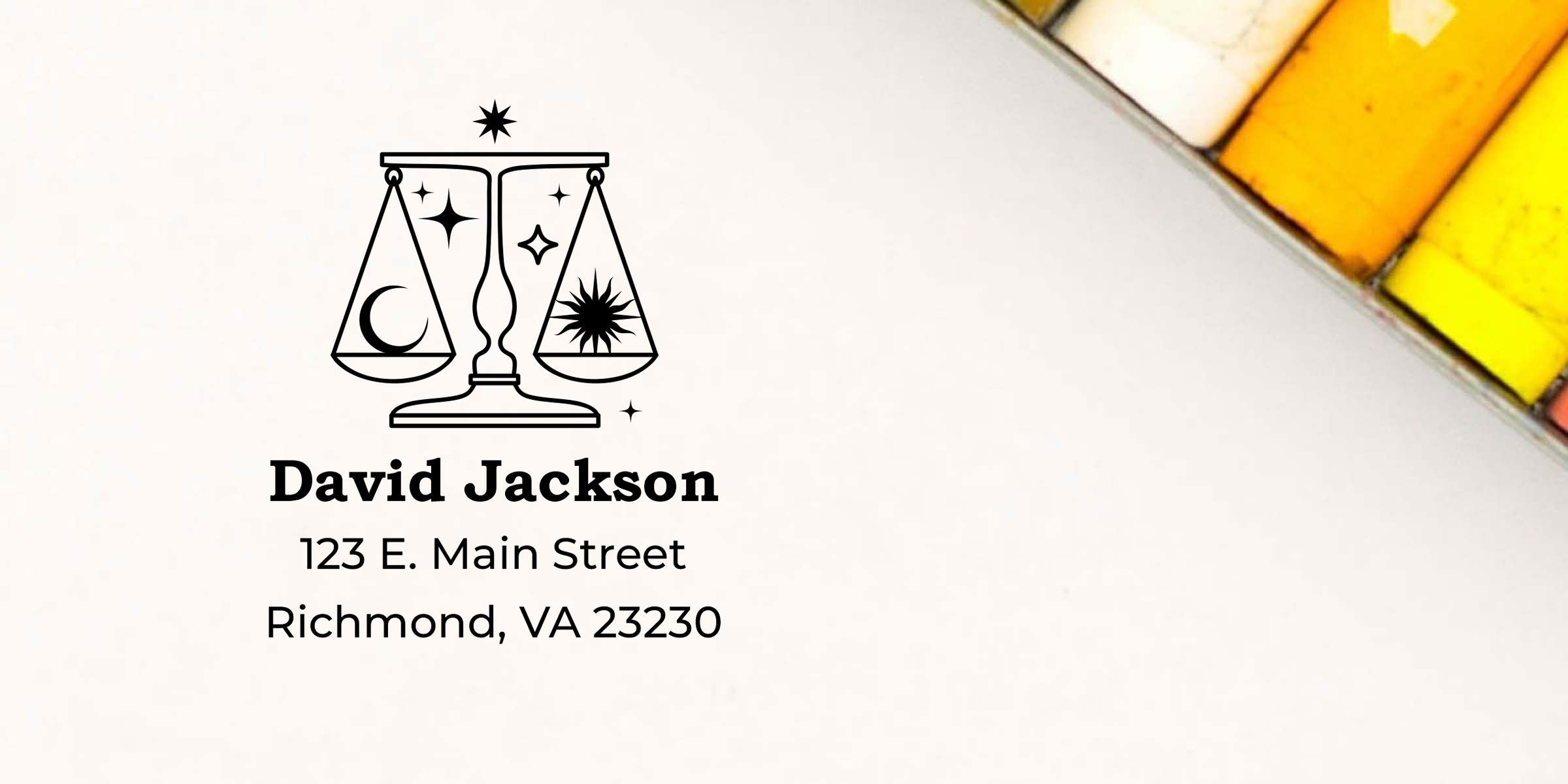David Jackson law office logo with scales of justice, moon and sun icons, and address 123 E. Main Street, Richmond, VA 23230 on white stationery