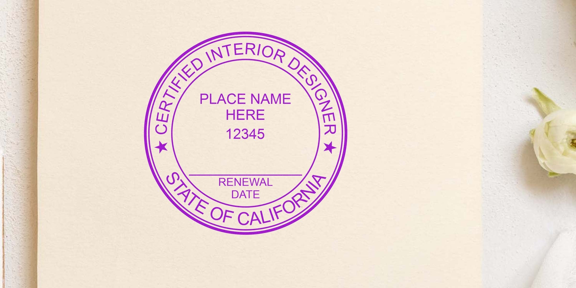 Certified California interior designer license renewal stamp on beige paper with white flower background, fulfilling interior designer stamp requirements.