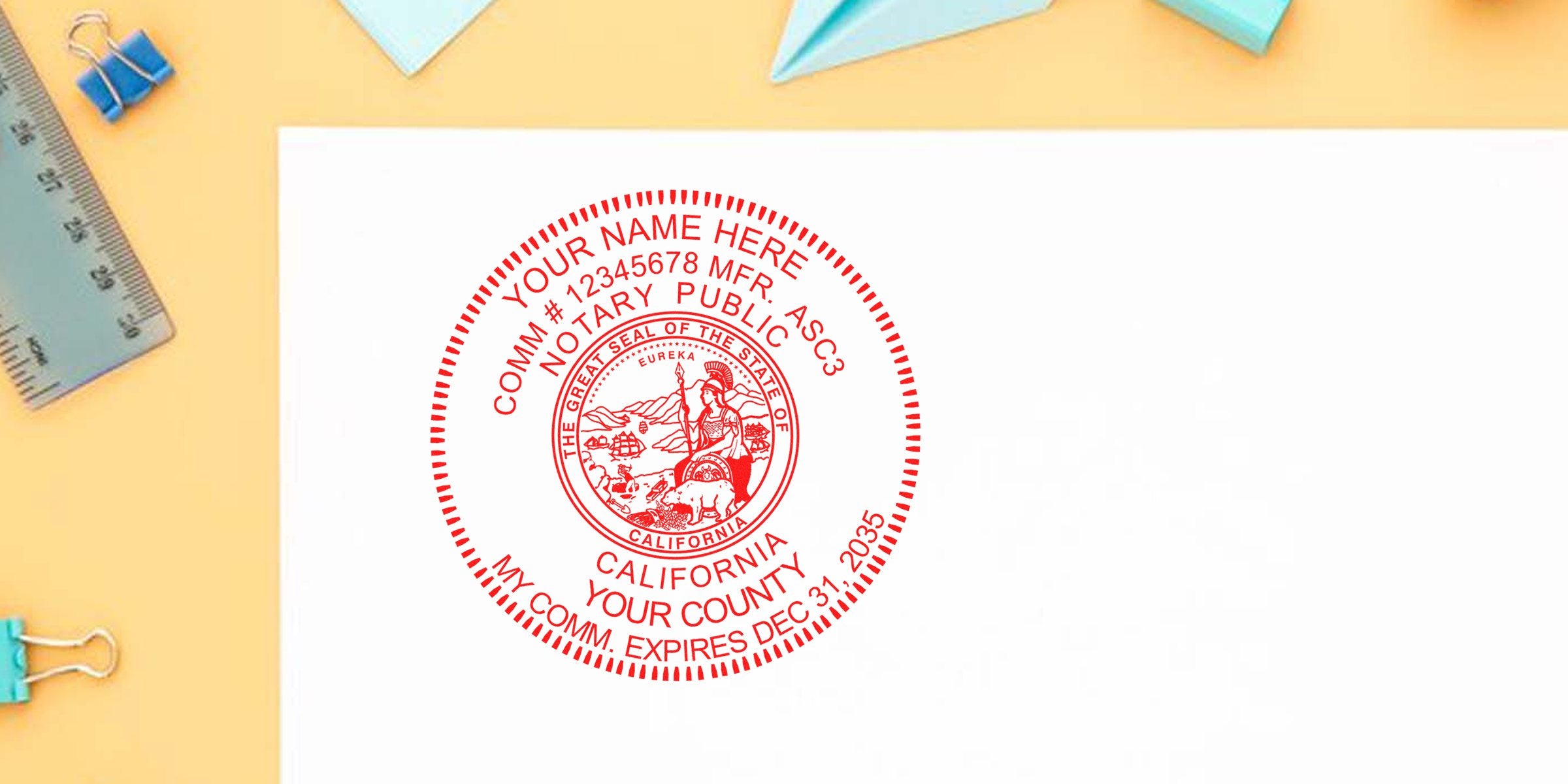 California notary public stamp on white paper with office supplies, showing how to become a notary in California.