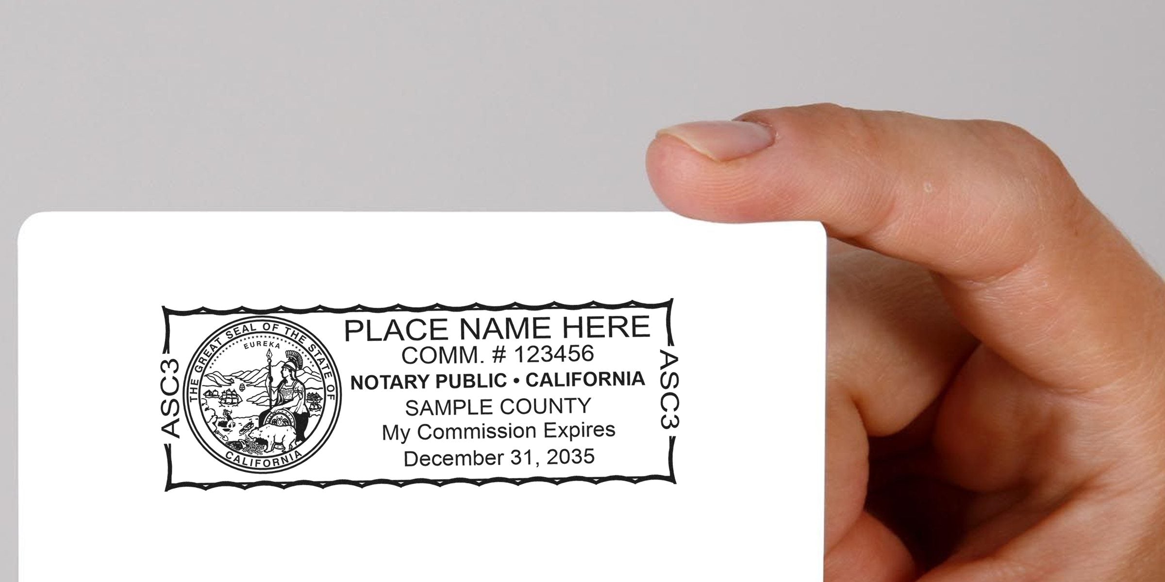 Hand holding California notary public stamp with commission expiration date, highlighting top notary options and essential supplies in California.