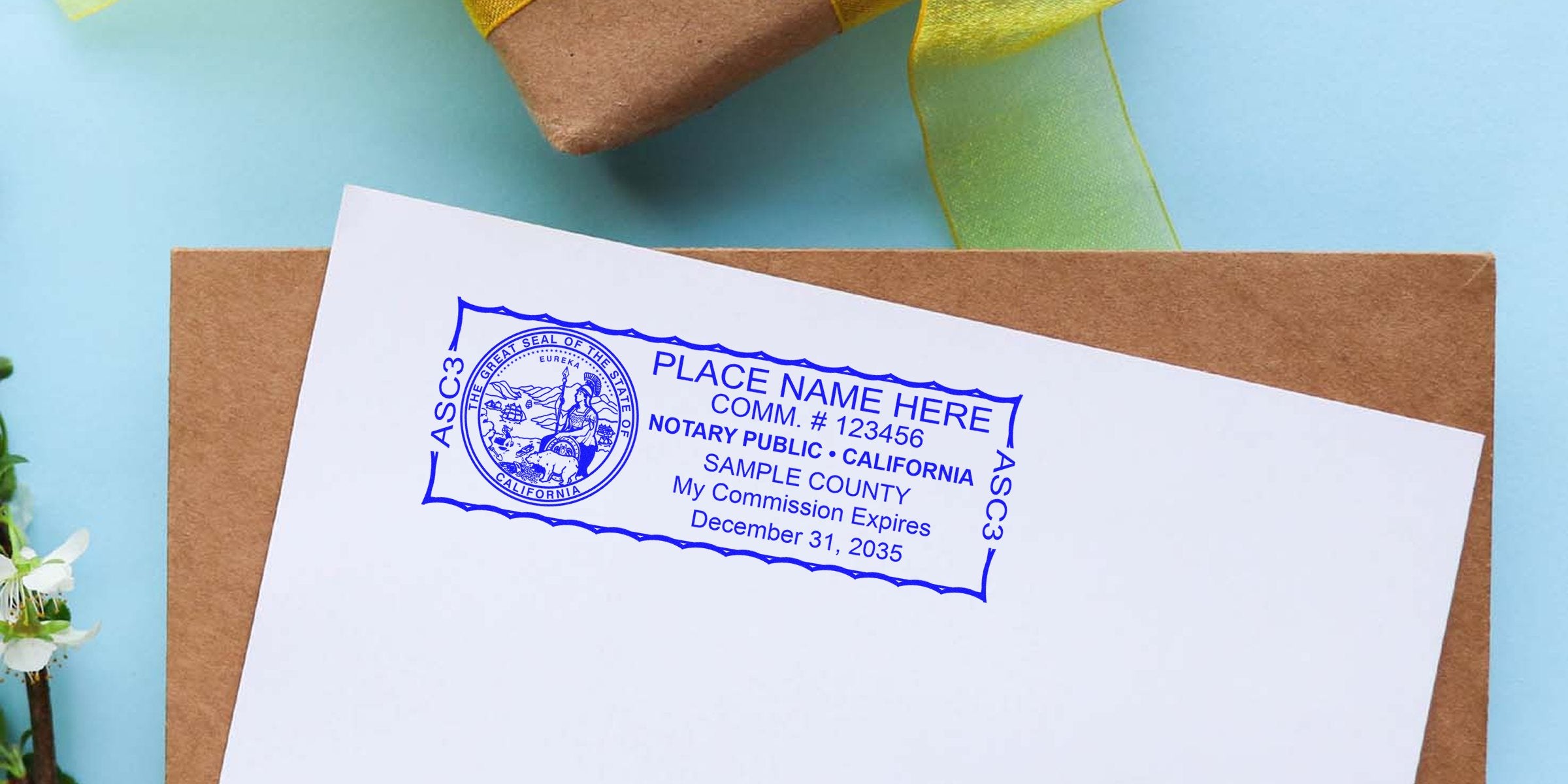 California notary stamp on white paper showing format sample with commission expiration date and official seal.