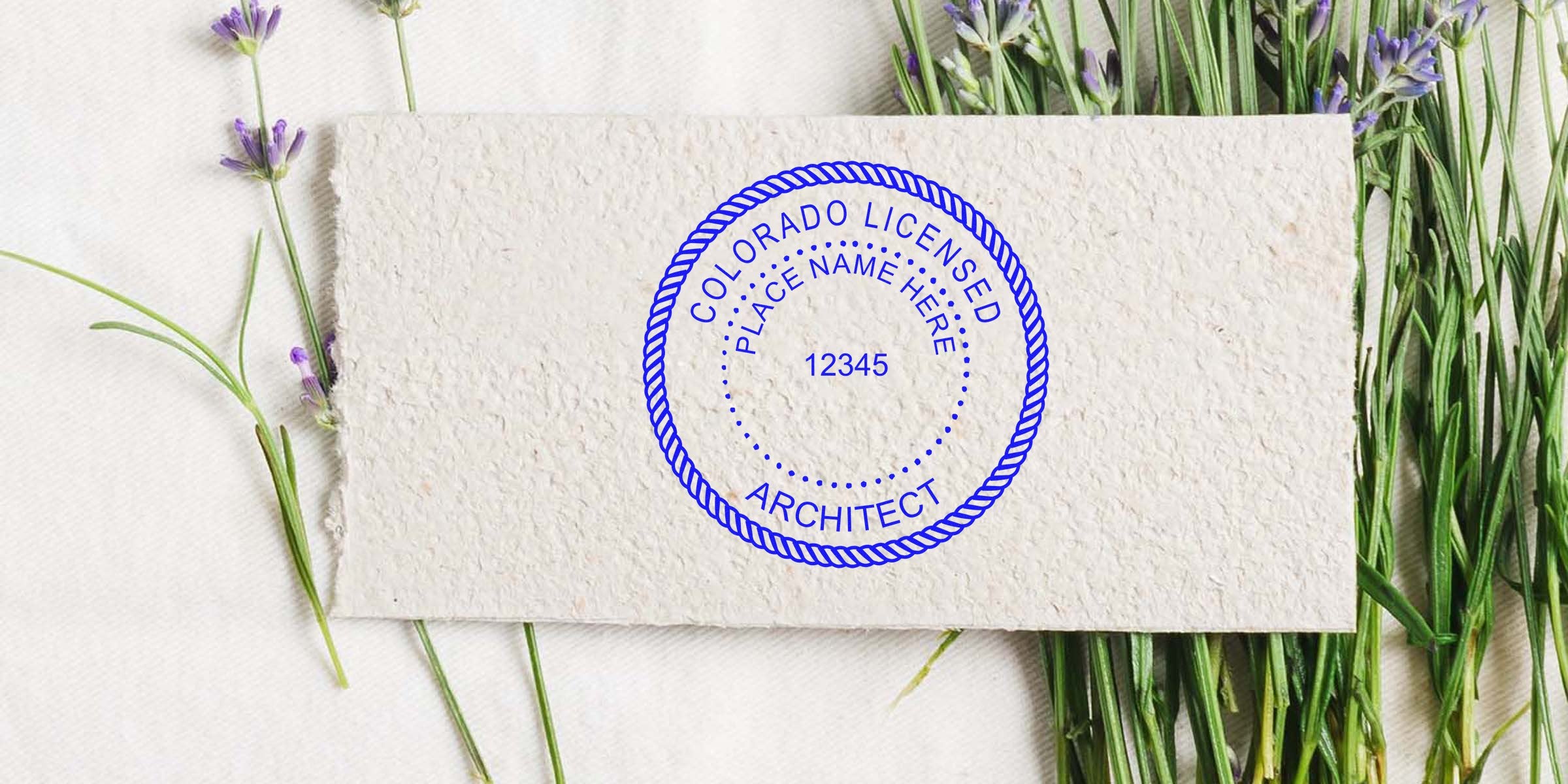 Colorado architect seal stamped on textured paper with a lavender flower background, adhering to architect seal guidelines.