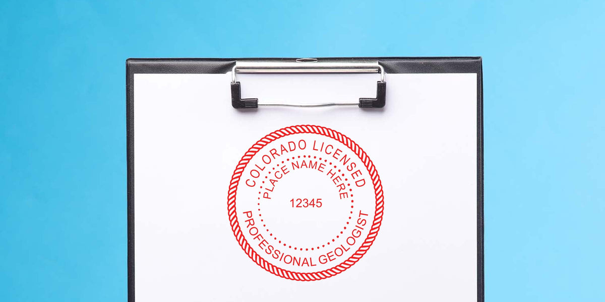 Colorado geologist seal stamped on clipboard against blue background, symbolizing geologist licensing in Colorado.
