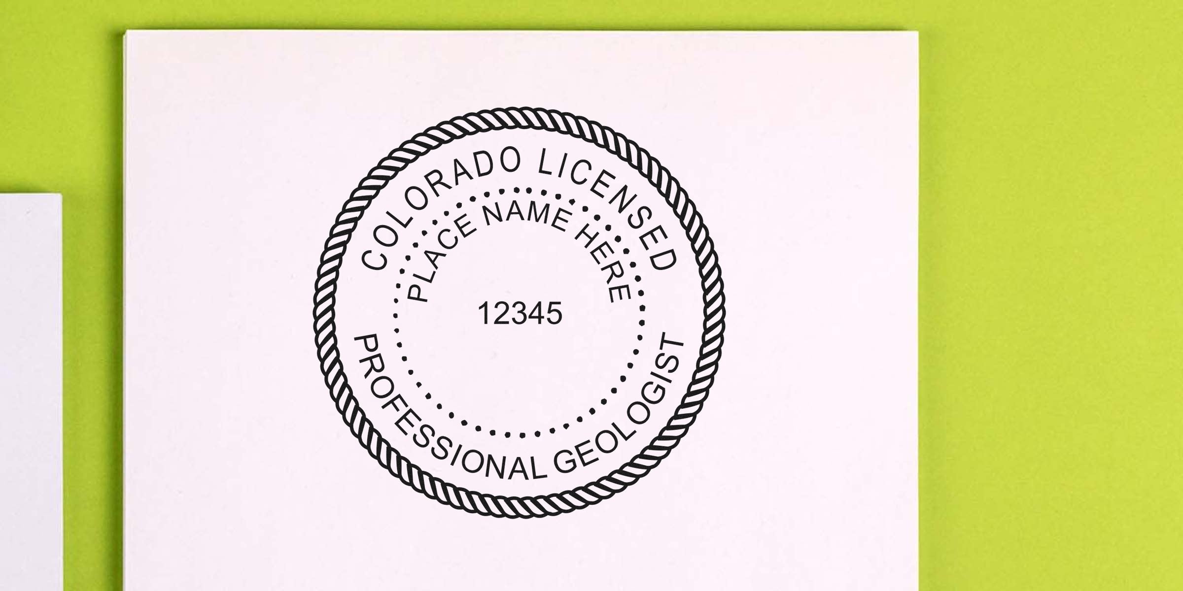 Colorado licensed professional geologist seal on white paper with name and license number, on green background, related to Colorado Geologist Stamp and License Renewal.