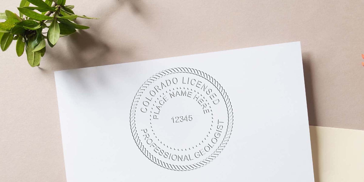 Embossed seal of a Colorado Licensed Geologist on white paper, showing the Geologist Seal Explanation.
