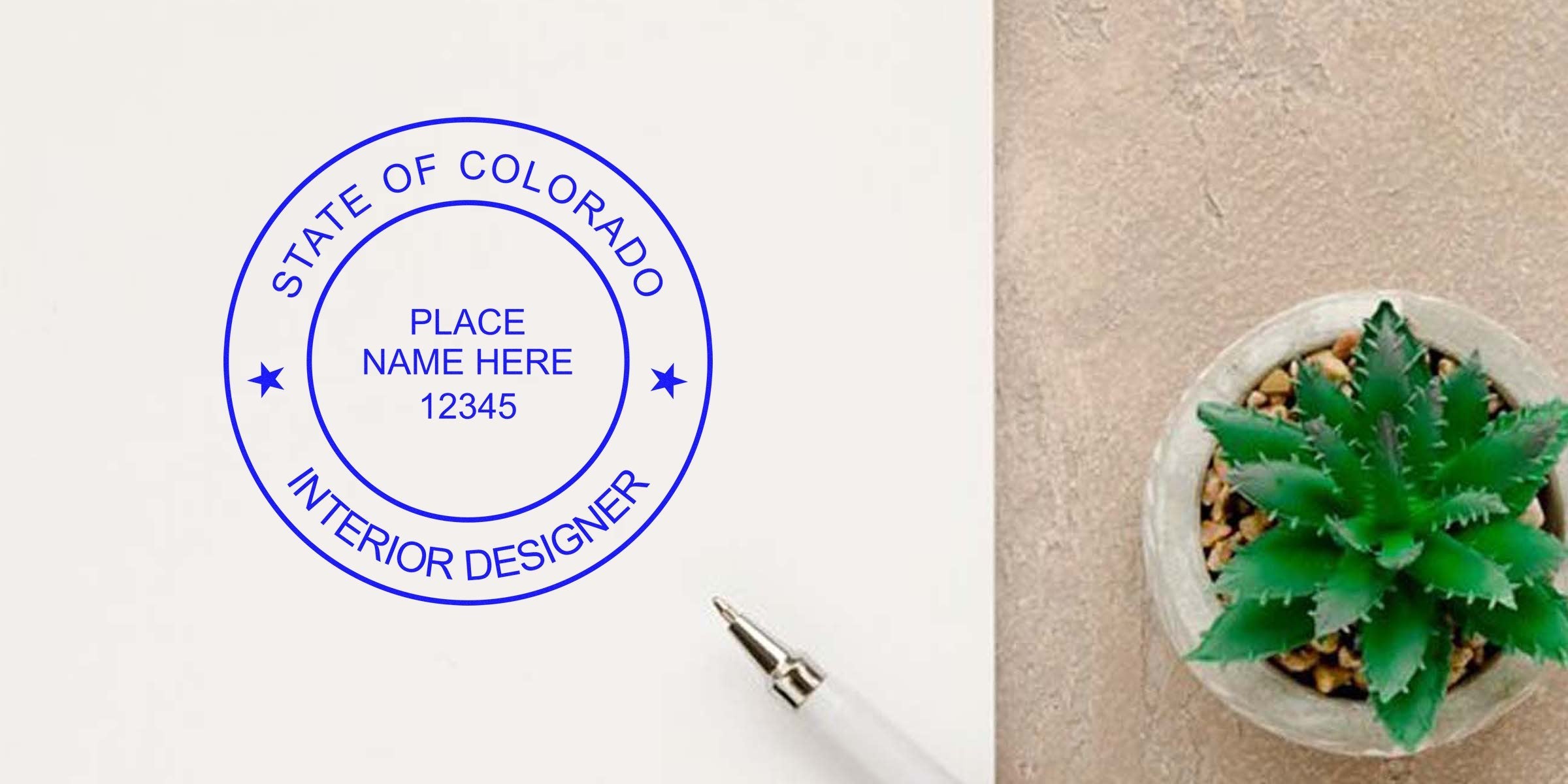 Colorado Interior Designer Seal on paper with pen and succulent, alongside Notary Guide Colorado on the table.