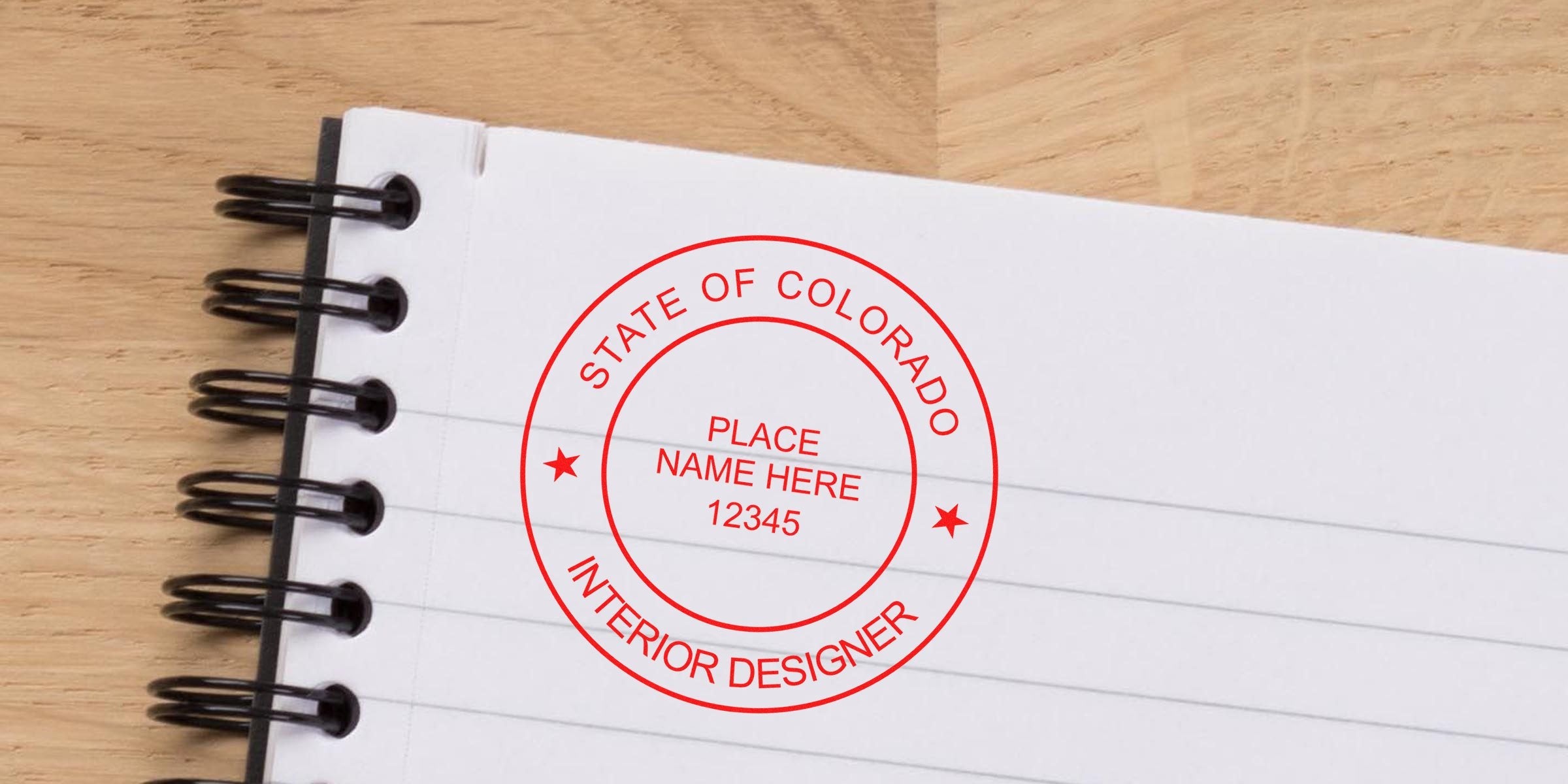 Colorado custom interior design stamp embossed on a notebook page, highlighting Colorado interior design with stamp embosser tips.