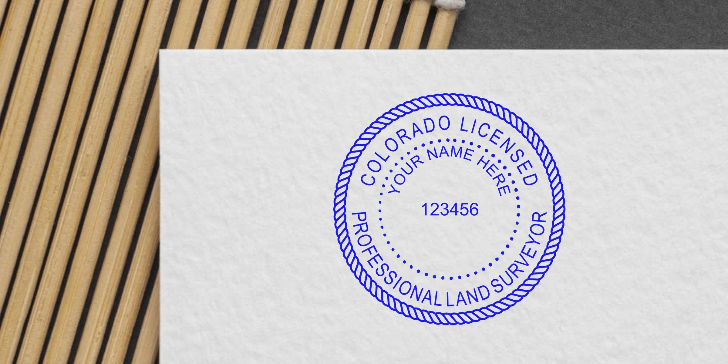 Colorado land surveyor stamp on white paper, available for purchase for land surveying services.