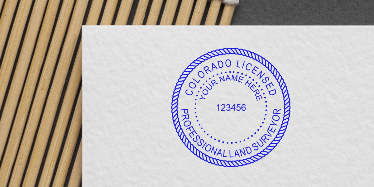Colorado land surveyor stamp on white paper, available for purchase for land surveying services.