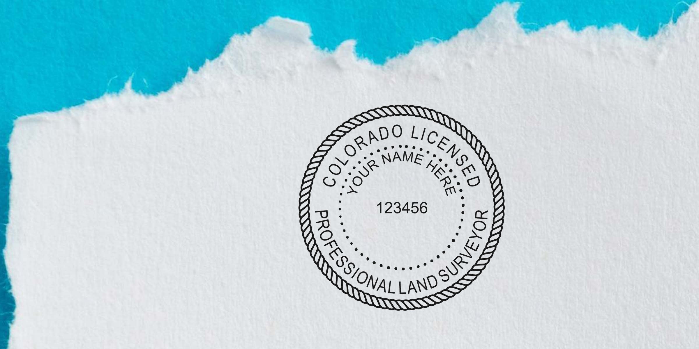 Colorado land surveyor stamp on torn paper, symbolizing expert land surveying in Colorado.