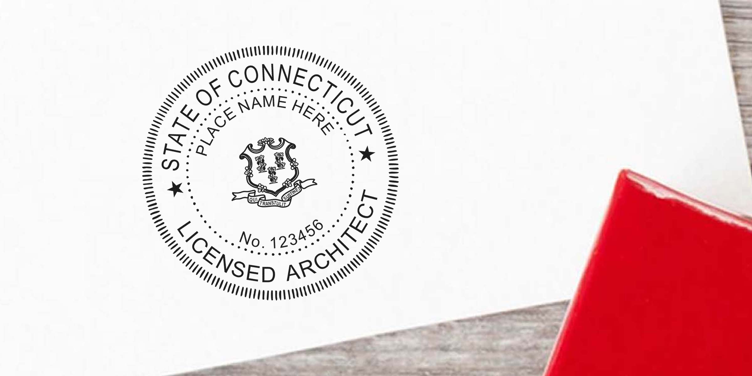 Connecticut architect seal stamp on white paper with red handle, designed per Connecticut architect seal guidelines.